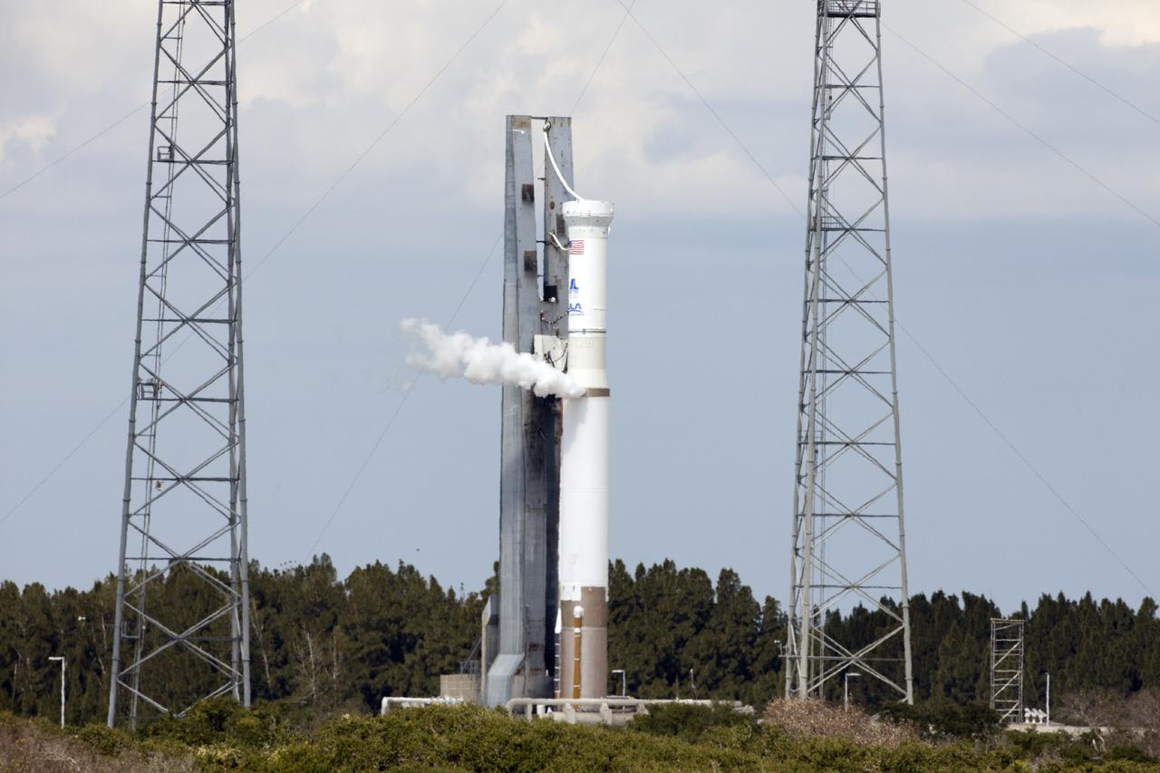 CAPE CANAVERAL, Fla. – The United Launch Alliance Atlas V rocket stands at Launch Complex 41 on Cape Canaveral Air Force Station in Florida during a "wet dress rehearsal." The test called for the launch vehicle to be fully loaded with propellants and put through a countdown procedure, ending just before the T-0 mark. The spacecraft is undergoing prelaunch processing activities in the Kennedy Space Center's Payload Hazardous Servicing Facility and was not atop the rocket for this rehearsal. The Atlas V rocket is slated to launch the Mars Atmosphere and Volatile Evolution, or MAVEN, spacecraft on a journey to the Red Planet on Nov. 18. The spacecraft is undergoing prelaunch processing activities in the Kennedy Space Center's Payload Hazardous Servicing Facility and was not atop the rocket for this rehearsal. Positioned in an orbit above the Red Planet, MAVEN will study the upper atmosphere of Mars in unprecedented detail. For more information, visit: http://www.nasa.gov/mission_pages/maven/main/index.html Photo credit: NASA/Daniel Cooper
