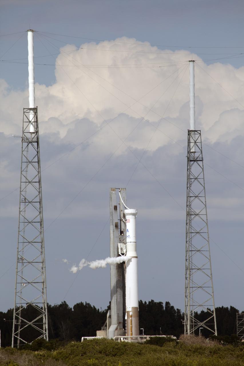 CAPE CANAVERAL, Fla. – The United Launch Alliance Atlas V rocket stands at Launch Complex 41 on Cape Canaveral Air Force Station in Florida during a "wet dress rehearsal." The test called for the launch vehicle to be fully loaded with propellants and put through a countdown procedure, ending just before the T-0 mark. The spacecraft is undergoing prelaunch processing activities in the Kennedy Space Center's Payload Hazardous Servicing Facility and was not atop the rocket for this rehearsal.      The Atlas V rocket is slated to launch the Mars Atmosphere and Volatile Evolution, or MAVEN, spacecraft on a journey to the Red Planet on Nov. 18. The spacecraft is undergoing prelaunch processing activities in the Kennedy Space Center's Payload Hazardous Servicing Facility and was not atop the rocket for this rehearsal. Positioned in an orbit above the Red Planet, MAVEN will study the upper atmosphere of Mars in unprecedented detail. For more information, visit: http://www.nasa.gov/mission_pages/maven/main/index.html Photo credit: NASA/Daniel Cooper