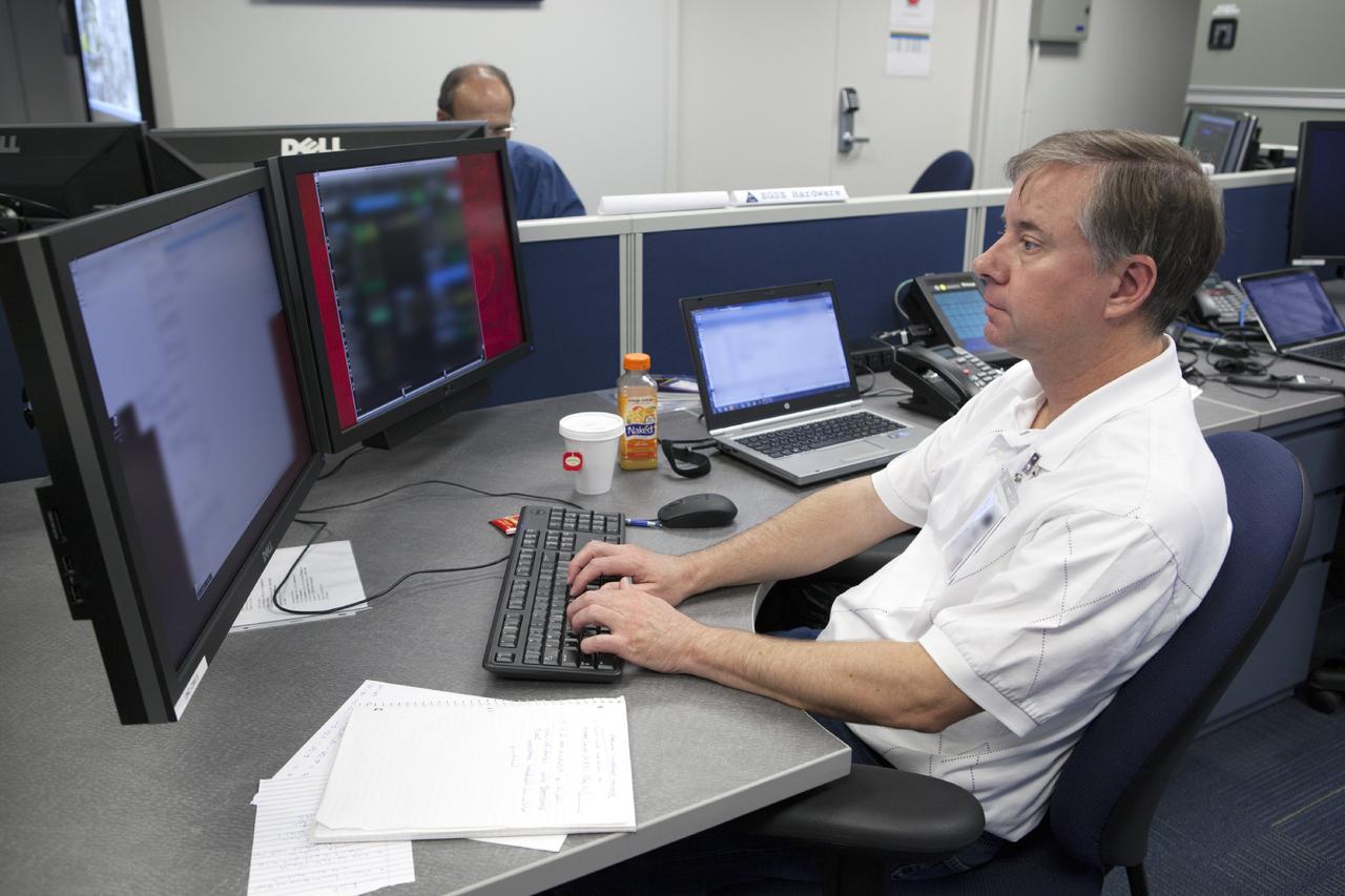 CAPE CANAVERAL, Fla. – Inside the Orion Test and Launch Control Center at NASA’s Kennedy Space Center in Florida, an engineer prepares for the first Exploration Flight Test 1, or EFT-1, power up test. NASA’s first-ever deep space craft, Orion, was powered on for the first time, marking a major milestone in the final year of preparations for flight. Orion’s avionics system was installed on the crew module and powered up for a series of systems tests.    Orion is the exploration spacecraft designed to carry astronauts to destinations not yet explored by humans, including an asteroid and Mars. It will have emergency abort capability, sustain the crew during space travel and provide safe re-entry from deep space return velocities. The first unpiloted test flight of Orion, EFT-1, is scheduled to launch in 2014 atop a Delta IV rocket and in 2017 on NASA’s Space Launch System rocket. For more information, visit www.nasa.gov/orion. Photo credit: Dimitri Gerondidakis