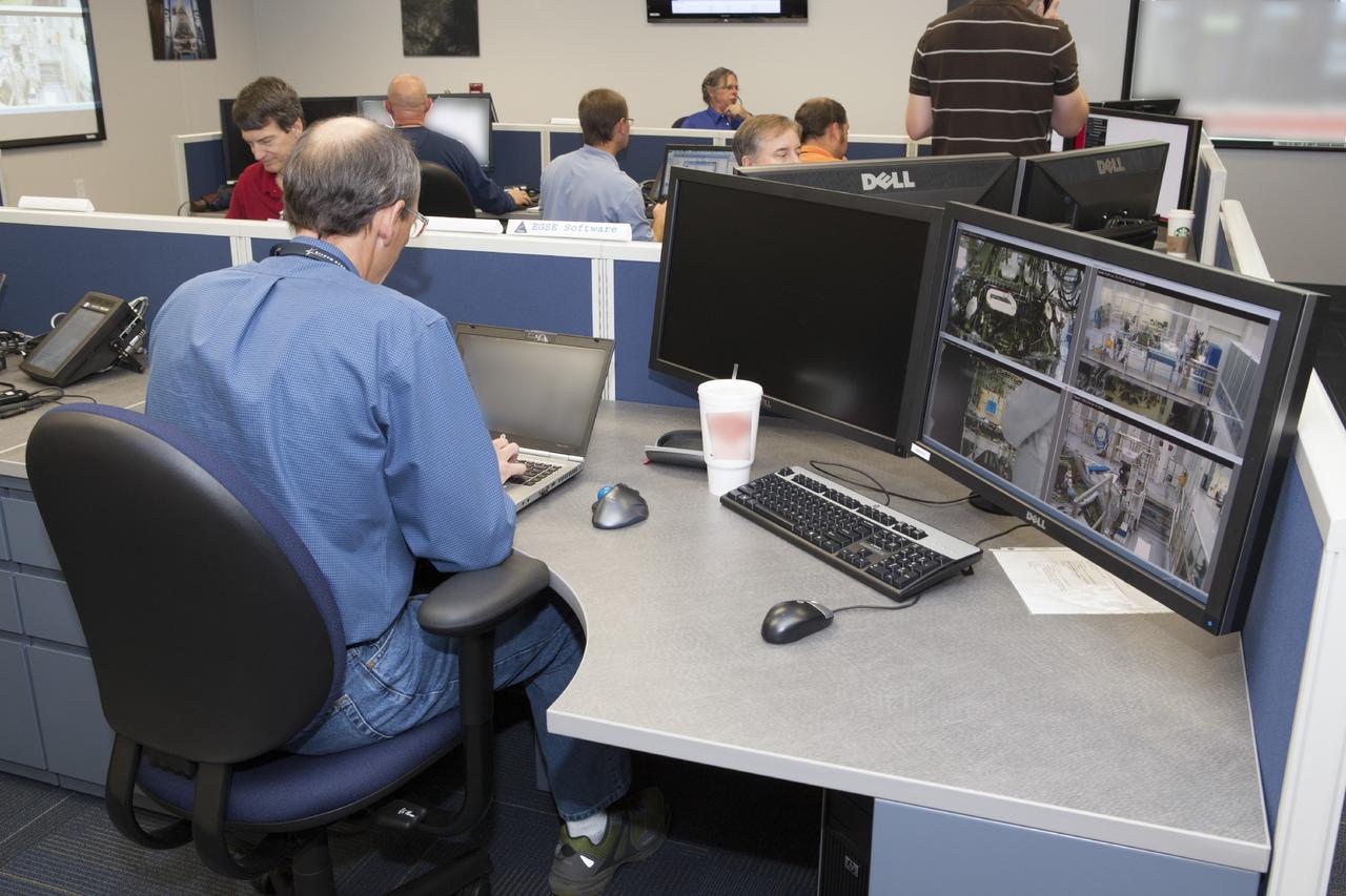 CAPE CANAVERAL, Fla. – Inside the Orion Test and Launch Control Center at NASA’s Kennedy Space Center in Florida, engineers monitor data for the first Exploration Flight Test 1, or EFT-1, power up test. NASA’s first-ever deep space craft, Orion, was powered on for the first time, marking a major milestone in the final year of preparations for flight. Orion’s avionics system was installed on the crew module and powered up for a series of systems tests.    Orion is the exploration spacecraft designed to carry astronauts to destinations not yet explored by humans, including an asteroid and Mars. It will have emergency abort capability, sustain the crew during space travel and provide safe re-entry from deep space return velocities. The first unpiloted test flight of Orion, EFT-1, is scheduled to launch in 2014 atop a Delta IV rocket and in 2017 on NASA’s Space Launch System rocket. For more information, visit www.nasa.gov/orion. Photo credit: Dimitri Gerondidakis