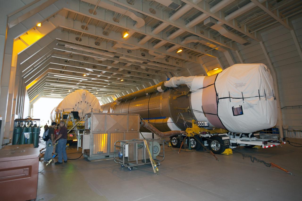 PORT CANAVERAL, Fla. – Following arrival of the United Launch Alliance barge, Delta Mariner, at Port Canaveral, Fla. engineers and technicians prepare to offload the Atlas V launch vehicle that will boost the Tracking and Data Relay Satellite, or TDRS-L, spacecraft into orbit around the Earth. The rocket's first-stage booster and Centaur upper stage will be transported to the hangar at the Atlas Spaceflight Operations Center on Cape Canaveral Air Force Station for checkout in preparation for launch.      TDRS-L is the second of three next-generation satellites designed to ensure vital operational continuity for the NASA Space Network. It is scheduled to launch from Cape Canaveral's Space Launch Complex 41 atop an Atlas V rocket in January 2014. The current Tracking and Data Relay Satellite system consists of eight in-orbit satellites distributed to provide near continuous information relay service to missions such as the Hubble Space Telescope and International Space Station. For more information, visit: http://www.nasa.gov/content/tracking-and-data-relay-satellite-tdrs/ Photo credit: NASA/ Kim Shiflett