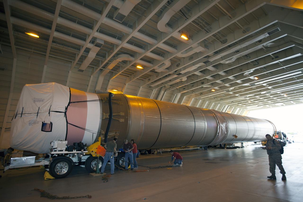 PORT CANAVERAL, Fla. – Following arrival of the United Launch Alliance barge, Delta Mariner, at Port Canaveral, Fla. engineers and technicians prepare to offload the Atlas V launch vehicle that will boost the Tracking and Data Relay Satellite, or TDRS-L, spacecraft into orbit around the Earth. The rocket's first-stage booster and Centaur upper stage will be transported to the hangar at the Atlas Spaceflight Operations Center on Cape Canaveral Air Force Station for checkout in preparation for launch.      TDRS-L is the second of three next-generation satellites designed to ensure vital operational continuity for the NASA Space Network. It is scheduled to launch from Cape Canaveral's Space Launch Complex 41 atop an Atlas V rocket in January 2014. The current Tracking and Data Relay Satellite system consists of eight in-orbit satellites distributed to provide near continuous information relay service to missions such as the Hubble Space Telescope and International Space Station. For more information, visit: http://www.nasa.gov/content/tracking-and-data-relay-satellite-tdrs/ Photo credit: NASA/ Kim Shiflett