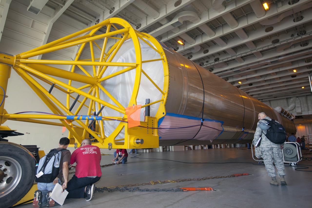 PORT CANAVERAL, Fla. – Following arrival of the United Launch Alliance barge, Delta Mariner, at Port Canaveral, Fla. engineers and technicians prepare to offload the Atlas V launch vehicle that will boost the Tracking and Data Relay Satellite, or TDRS-L, spacecraft into orbit around the Earth. The rocket's first-stage booster and Centaur upper stage will be transported to the hangar at the Atlas Spaceflight Operations Center on Cape Canaveral Air Force Station for checkout in preparation for launch.      TDRS-L is the second of three next-generation satellites designed to ensure vital operational continuity for the NASA Space Network. It is scheduled to launch from Cape Canaveral's Space Launch Complex 41 atop an Atlas V rocket in January 2014. The current Tracking and Data Relay Satellite system consists of eight in-orbit satellites distributed to provide near continuous information relay service to missions such as the Hubble Space Telescope and International Space Station. For more information, visit: http://www.nasa.gov/content/tracking-and-data-relay-satellite-tdrs/ Photo credit: NASA/ Kim Shiflett