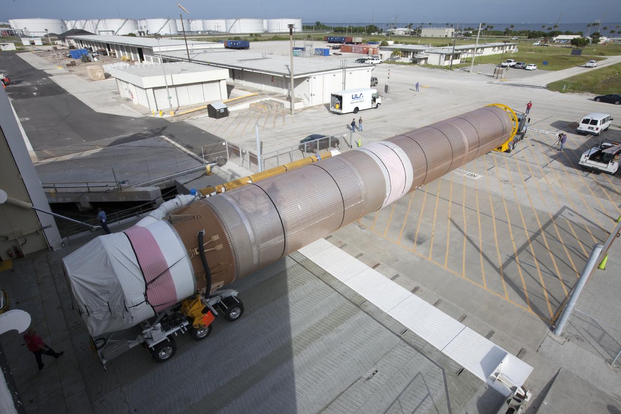 PORT CANAVERAL, Fla. – Following arrival at Port Canaveral, Fla., the United Launch Alliance Atlas V rocket that will boost the Tracking and Data Relay Satellite, or TDRS-L, spacecraft into orbit is being towed off the barge, Delta Mariner. The launch vehicle will then be transported to Cape Canaveral Air Force Station's Atlas Spaceflight Operations Center for checkout in preparation for launch.    TDRS-L is the second of three next-generation satellites designed to ensure vital operational continuity for the NASA Space Network. It is scheduled to launch from Cape Canaveral's Space Launch Complex 41 atop an Atlas V rocket in January 2014. The current Tracking and Data Relay Satellite system consists of eight in-orbit satellites distributed to provide near continuous information relay service to missions such as the Hubble Space Telescope and International Space Station. For more information, visit: http://www.nasa.gov/content/tracking-and-data-relay-satellite-tdrs/ Photo credit: NASA/ Kim Shiflett