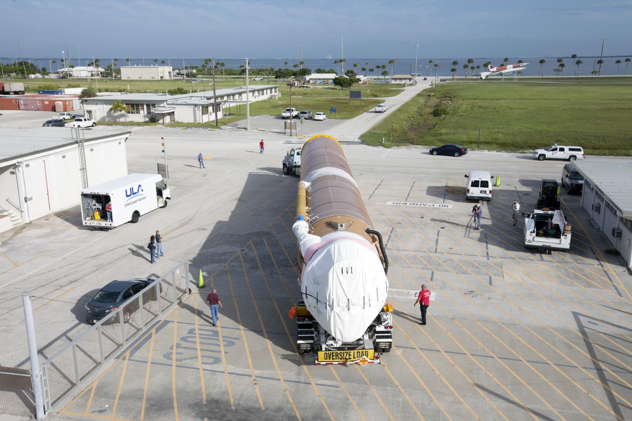 PORT CANAVERAL, Fla. – Following arrival at Port Canaveral, Fla., the United Launch Alliance Atlas V rocket that will boost the Tracking and Data Relay Satellite, or TDRS-L, spacecraft into orbit is being towed off the barge, Delta Mariner. The launch vehicle will then be transported to Cape Canaveral Air Force Station's Atlas Spaceflight Operations Center for checkout in preparation for launch.      TDRS-L is the second of three next-generation satellites designed to ensure vital operational continuity for the NASA Space Network. It is scheduled to launch from Cape Canaveral's Space Launch Complex 41 atop an Atlas V rocket in January 2014. The current Tracking and Data Relay Satellite system consists of eight in-orbit satellites distributed to provide near continuous information relay service to missions such as the Hubble Space Telescope and International Space Station. For more information, visit: http://www.nasa.gov/content/tracking-and-data-relay-satellite-tdrs/ Photo credit: NASA/ Kim Shiflett