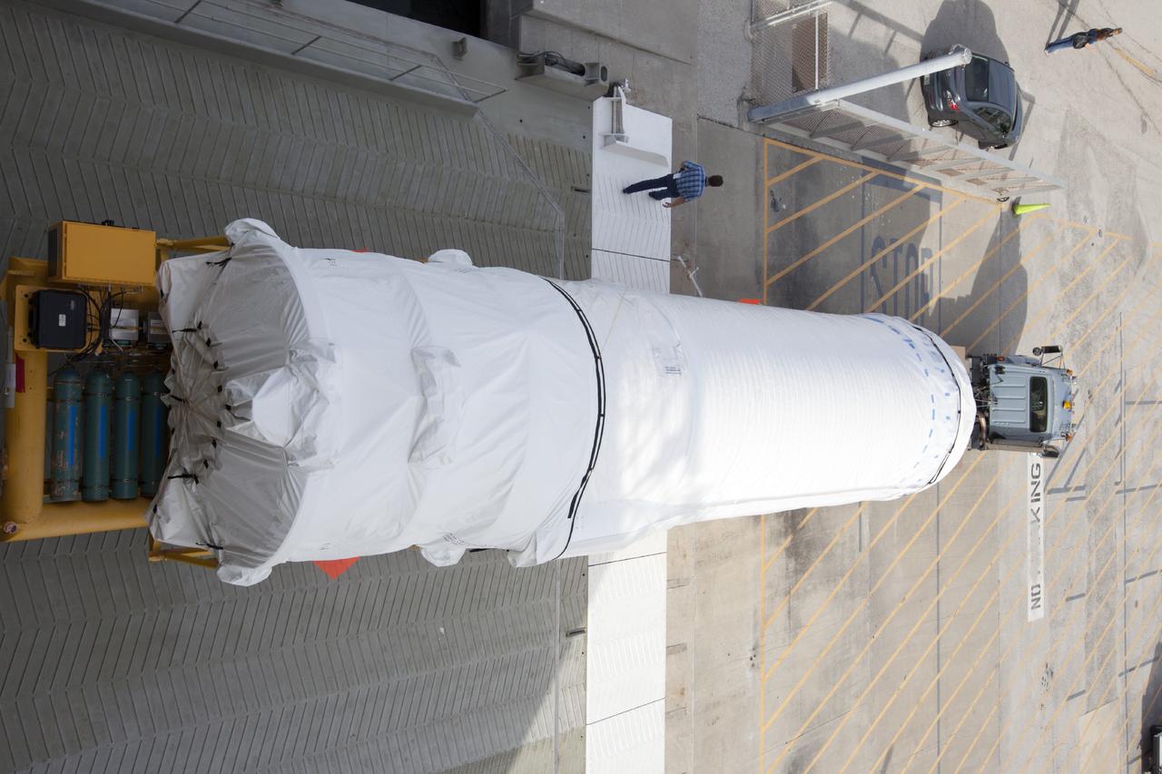 PORT CANAVERAL, Fla. – Following arrival at Port Canaveral, Fla., the United Launch Alliance Centaur upper stage that will boost the Tracking and Data Relay Satellite, or TDRS-L, spacecraft into orbit is being towed off the barge, Delta Mariner. The first and second stages of the launch vehicle will then be transported to Cape Canaveral Air Force Station's Atlas Spaceflight Operations Center for checkout in preparation for launch.        TDRS-L is the second of three next-generation satellites designed to ensure vital operational continuity for the NASA Space Network. It is scheduled to launch from Cape Canaveral's Space Launch Complex 41 atop an Atlas V rocket in January 2014. The current Tracking and Data Relay Satellite system consists of eight in-orbit satellites distributed to provide near continuous information relay service to missions such as the Hubble Space Telescope and International Space Station. For more information, visit: http://www.nasa.gov/content/tracking-and-data-relay-satellite-tdrs/ Photo credit: NASA/ Kim Shiflett