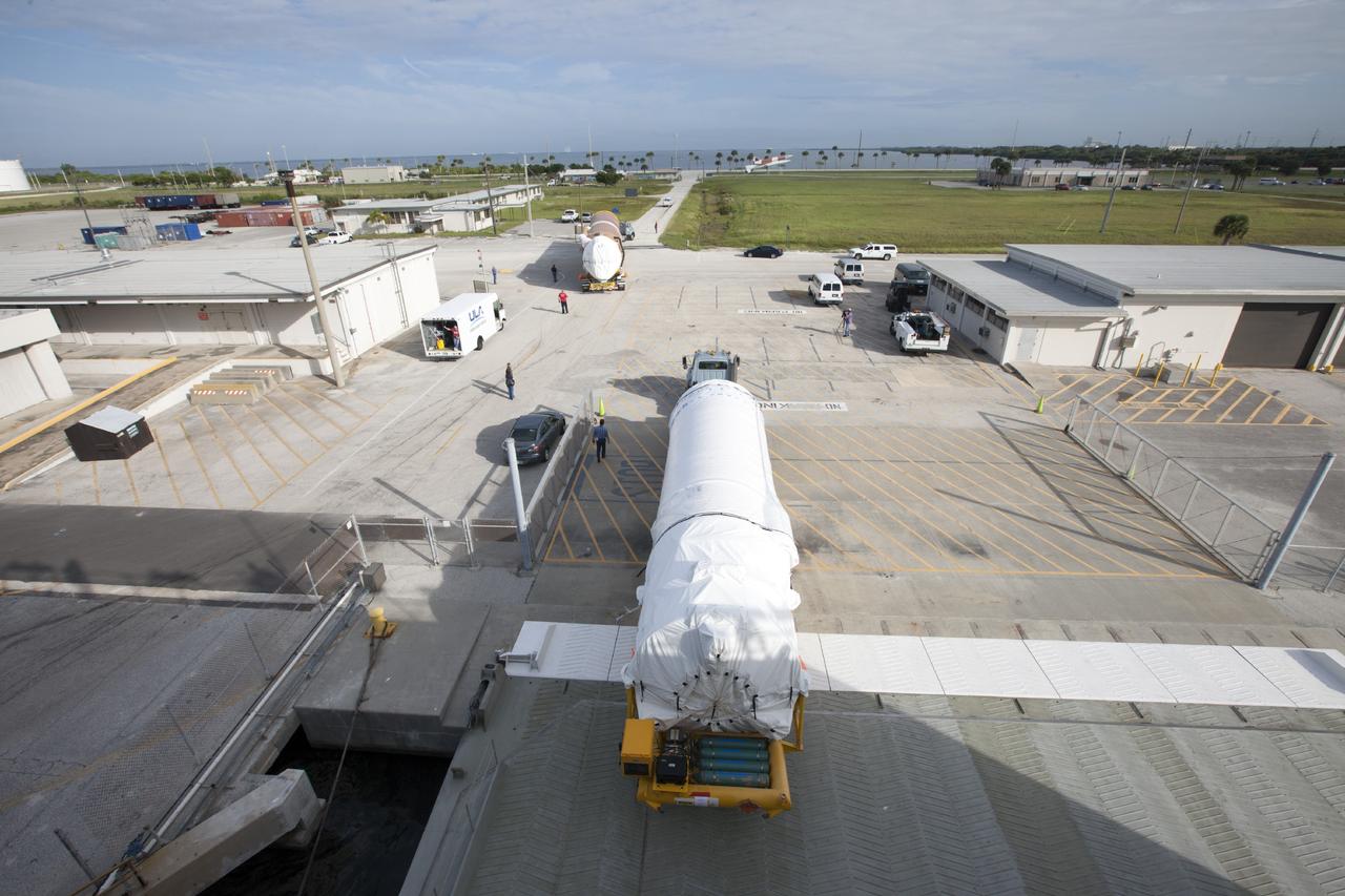 PORT CANAVERAL, Fla. – Following arrival at Port Canaveral, Fla., the United Launch Alliance Centaur upper stage that will boost the Tracking and Data Relay Satellite, or TDRS-L, spacecraft into orbit is being towed off the barge, Delta Mariner. The first and second stages of the launch vehicle will then be transported to Cape Canaveral Air Force Station's Atlas Spaceflight Operations Center for checkout in preparation for launch.        TDRS-L is the second of three next-generation satellites designed to ensure vital operational continuity for the NASA Space Network. It is scheduled to launch from Cape Canaveral's Space Launch Complex 41 atop an Atlas V rocket in January 2014. The current Tracking and Data Relay Satellite system consists of eight in-orbit satellites distributed to provide near continuous information relay service to missions such as the Hubble Space Telescope and International Space Station. For more information, visit: http://www.nasa.gov/content/tracking-and-data-relay-satellite-tdrs/ Photo credit: NASA/ Kim Shiflett