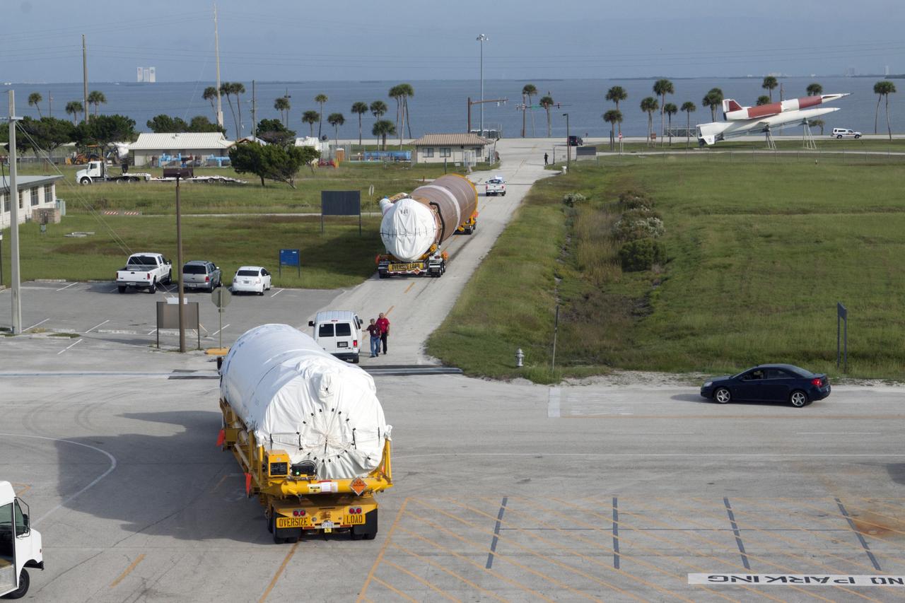 PORT CANAVERAL, Fla. – Following arrival at Port Canaveral, Fla., the United Launch Alliance Atlas V first stage and Centaur upper stage that will boost the Tracking and Data Relay Satellite, or TDRS-L, spacecraft into orbit is being transported to Cape Canaveral Air Force Station's Atlas Spaceflight Operations Center for checkout in preparation for launch. TDRS-L is the second of three next-generation satellites designed to ensure vital operational continuity for the NASA Space Network. It is scheduled to launch from Cape Canaveral's Space Launch Complex 41 atop an Atlas V rocket in January 2014. The current Tracking and Data Relay Satellite system consists of eight in-orbit satellites distributed to provide near continuous information relay service to missions such as the Hubble Space Telescope and International Space Station. For more information, visit: http://www.nasa.gov/content/tracking-and-data-relay-satellite-tdrs/ Photo credit: NASA/ Kim Shiflett