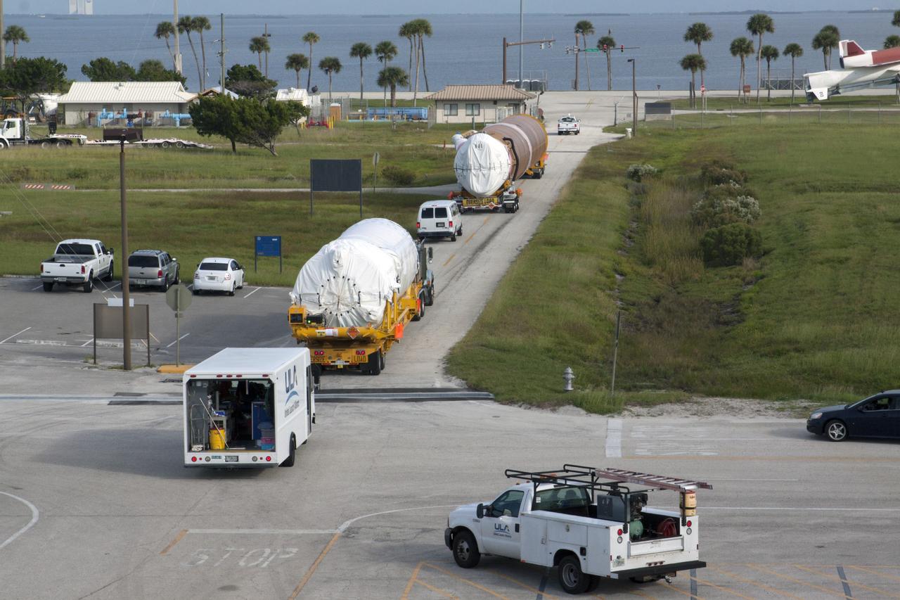 PORT CANAVERAL, Fla. – Following arrival at Port Canaveral, Fla., the United Launch Alliance Atlas V first stage and Centaur upper stage that will boost the Tracking and Data Relay Satellite, or TDRS-L, spacecraft into orbit is being transported to Cape Canaveral Air Force Station's Atlas Spaceflight Operations Center for checkout in preparation for launch. TDRS-L is the second of three next-generation satellites designed to ensure vital operational continuity for the NASA Space Network. It is scheduled to launch from Cape Canaveral's Space Launch Complex 41 atop an Atlas V rocket in January 2014. The current Tracking and Data Relay Satellite system consists of eight in-orbit satellites distributed to provide near continuous information relay service to missions such as the Hubble Space Telescope and International Space Station. For more information, visit: http://www.nasa.gov/content/tracking-and-data-relay-satellite-tdrs/ Photo credit: NASA/ Kim Shiflett