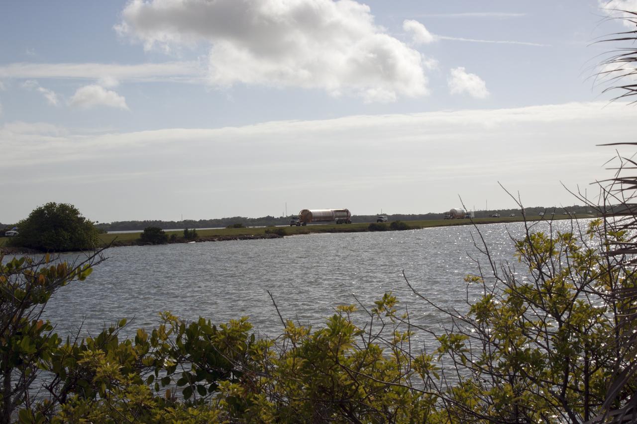 CAPE CANAVERAL, Fla. – The United Launch Alliance Atlas V launch vehicle that will boost the Tracking and Data Relay Satellite, or TDRS-L, spacecraft into orbit is being transported to the hangar at the Atlas Spaceflight Operations Center on Cape Canaveral Air Force Station for checkout in preparation for launch. TDRS-L is the second of three next-generation satellites designed to ensure vital operational continuity for the NASA Space Network. It is scheduled to launch from Cape Canaveral's Space Launch Complex 41 atop an Atlas V rocket in January 2014. The current Tracking and Data Relay Satellite system consists of eight in-orbit satellites distributed to provide near continuous information relay service to missions such as the Hubble Space Telescope and International Space Station. For more information, visit: http://www.nasa.gov/content/tracking-and-data-relay-satellite-tdrs/ Photo credit: NASA/ Jim Grossman