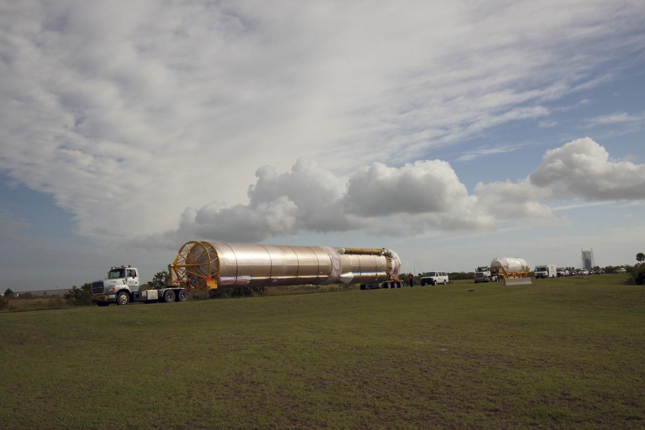 CAPE CANAVERAL, Fla. – The United Launch Alliance Atlas V launch vehicle, left, and Centaur upper stage that will boost the Tracking and Data Relay Satellite, or TDRS-L, spacecraft into orbit is being transported to the hangar at the Atlas Spaceflight Operations Center on Cape Canaveral Air Force Station for checkout in preparation for launch. TDRS-L is the second of three next-generation satellites designed to ensure vital operational continuity for the NASA Space Network. It is scheduled to launch from Cape Canaveral's Space Launch Complex 41 atop an Atlas V rocket in January 2014. The current Tracking and Data Relay Satellite system consists of eight in-orbit satellites distributed to provide near continuous information relay service to missions such as the Hubble Space Telescope and International Space Station. For more information, visit: http://www.nasa.gov/content/tracking-and-data-relay-satellite-tdrs/ Photo credit: NASA/ Jim Grossman
