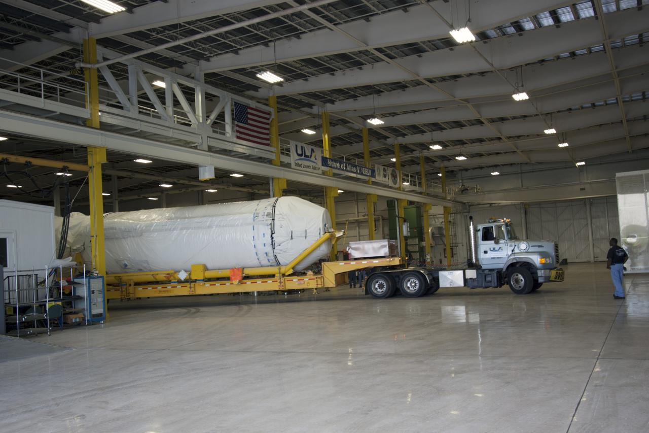 CAPE CANAVERAL, Fla. – The United Launch Alliance Centaur upper stage that will boost the Tracking and Data Relay Satellite, or TDRS-L, spacecraft into orbit arrives at the Atlas Spaceflight Operations Center on Cape Canaveral Air Force Station for checkout in preparation for launch. TDRS-L is the second of three next-generation satellites designed to ensure vital operational continuity for the NASA Space Network. It is scheduled to launch from Cape Canaveral's Space Launch Complex 41 atop an Atlas V rocket in January 2014. The current Tracking and Data Relay Satellite system consists of eight in-orbit satellites distributed to provide near continuous information relay service to missions such as the Hubble Space Telescope and International Space Station. For more information, visit: http://www.nasa.gov/content/tracking-and-data-relay-satellite-tdrs/ Photo credit: NASA/ Jim Grossman