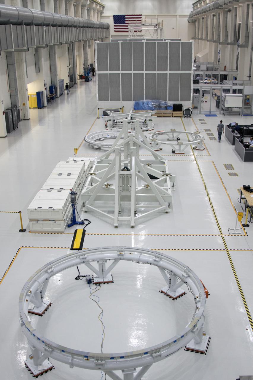 CAPE CANAVERAL, Fla. – Inside the Operations and Checkout Building at NASA’s Kennedy Space Center in Florida, various work stands have been positioned along the high bay floor for processing of components for the Orion spacecraft.    Orion is the exploration spacecraft designed to carry astronauts to destinations not yet explored by humans, including an asteroid and Mars. It will have emergency abort capability, sustain the crew during space travel and provide safe re-entry from deep space return velocities. The first unpiloted test flight of the Orion is scheduled to launch in 2014 atop a Delta IV rocket and in 2017 on NASA’s Space Launch System rocket. For more information, visit http://www.nasa.gov/orion. Photo credit: NASA/Jim Grossmann