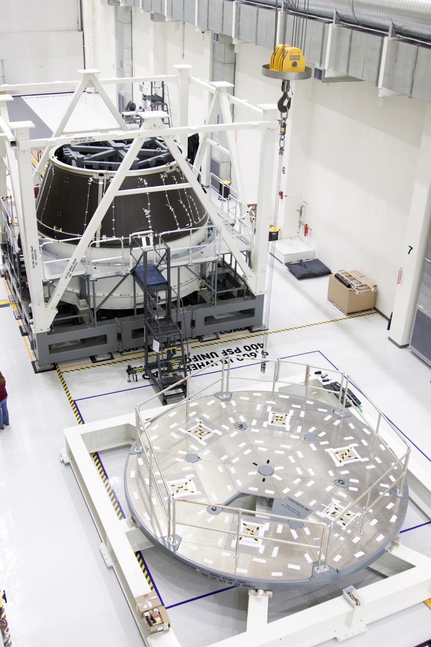 CAPE CANAVERAL, Fla. – Inside the Operations and Checkout Building high bay at NASA’s Kennedy Space Center in Florida, the spacecraft adapter cone for the Orion vehicle sits in a static load test tool. Preparations are underway to transfer the adapter cone to a work stand. Orion is the exploration spacecraft designed to carry astronauts to destinations not yet explored by humans, including an asteroid and Mars. It will have emergency abort capability, sustain the crew during space travel and provide safe re-entry from deep space return velocities. The first unpiloted test flight of the Orion is scheduled to launch in 2014 atop a Delta IV rocket and in 2017 on NASA’s Space Launch System rocket. For more information, visit http://www.nasa.gov/orion. Photo credit: NASA/Jim Grossmann