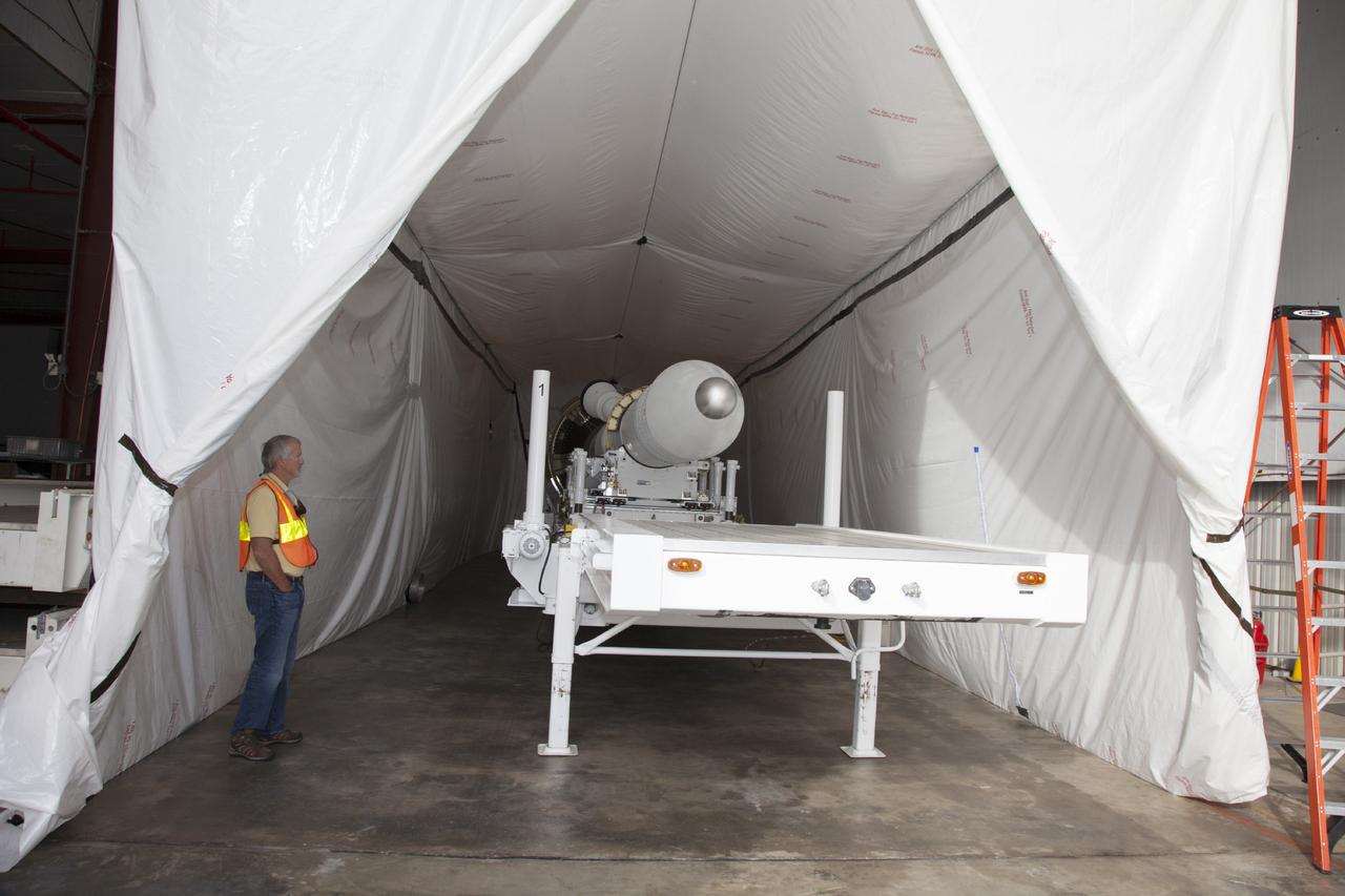 CAPE CANAVERAL, Fla. – At the Launch Abort System Facility at NASA’s Kennedy Space Center in Florida, the launch abort system, or LAS, for the Orion Exploration Flight Test-1, has been transferred from the high bay to a low bay at the facility. The low bay has been prepared for additional LAS processing. Orion is the exploration spacecraft designed to carry crews to space beyond low Earth orbit. It will provide emergency abort capability, sustain the crew during the space travel and provide safe re-entry from deep space return velocities. The LAS is designed to safely pull the Orion crew module away from the launch vehicle in the event of an emergency on the launch pad or during the initial ascent of NASA’s Space Launch System, or SLS, rocket. Orion’s first unpiloted test flight is scheduled to launch in 2014 atop a Delta IV rocket. A second uncrewed flight test is scheduled for 2017 on the SLS rocket. For more information, visit http://www.nasa.gov/orion. Photo credit: NASA/Daniel Casper