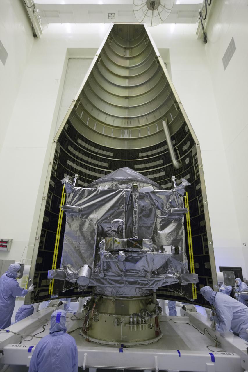 CAPE CANAVERAL, Fla. – Inside the Payload Hazardous Servicing Facility at NASA's Kennedy Space Center in Florida, engineers and technicians begin encapsulation of the Mars Atmosphere and Volatile Evolution, or MAVEN, spacecraft inside its payload fairing.      MAVEN is being prepared for its scheduled launch on Nov 18, 2013 from Cape Canaveral Air Force Station, Fla. atop a United Launch Alliance Atlas V rocket. Positioned in an orbit above the Red Planet, MAVEN will study the upper atmosphere of Mars in unprecedented detail. For more information, visit: http://www.nasa.gov/mission_pages/maven/main/index.html Photo credit: NASA/Kim Shiflett