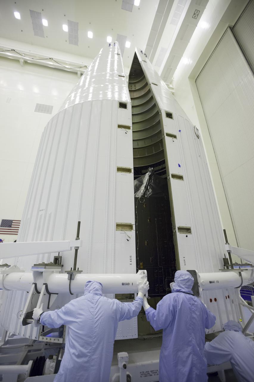 CAPE CANAVERAL, Fla. – Inside the Payload Hazardous Servicing Facility at NASA's Kennedy Space Center in Florida, engineers and technicians encapsulate the Mars Atmosphere and Volatile Evolution, or MAVEN, spacecraft inside its payload fairing.      MAVEN is being prepared for its scheduled launch on Nov 18, 2013 from Cape Canaveral Air Force Station, Fla. atop a United Launch Alliance Atlas V rocket. Positioned in an orbit above the Red Planet, MAVEN will study the upper atmosphere of Mars in unprecedented detail. For more information, visit: http://www.nasa.gov/mission_pages/maven/main/index.html Photo credit: NASA/Kim Shiflett