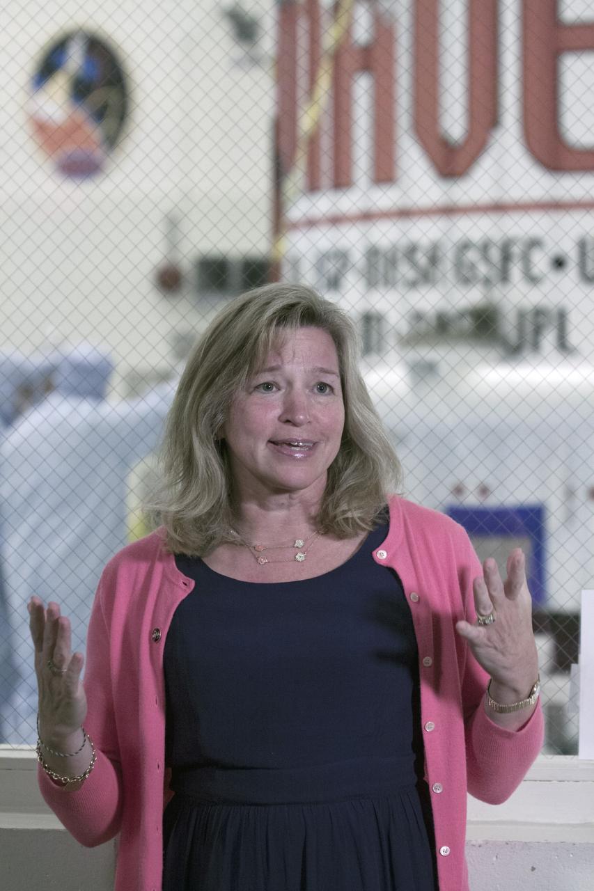 CAPE CANAVERAL, Fla. – Inside the Payload Hazardous Servicing Facility at NASA's Kennedy Space Center in Florida, Dr. Ellen Stofan, NASA's chief scientist, speaks to members of the news media. The Mars Atmosphere and Volatile Evolution, or MAVEN, spacecraft is in the background following encapsulation in its payload fairing.    MAVEN is being prepared for its scheduled launch on Nov 18, 2013 from Cape Canaveral Air Force Station, Fla. atop a United Launch Alliance Atlas V rocket. Positioned in an orbit above the Red Planet, MAVEN will study the upper atmosphere of Mars in unprecedented detail. For more information, visit: http://www.nasa.gov/mission_pages/maven/main/index.html Photo credit: NASA/Kim Shiflett