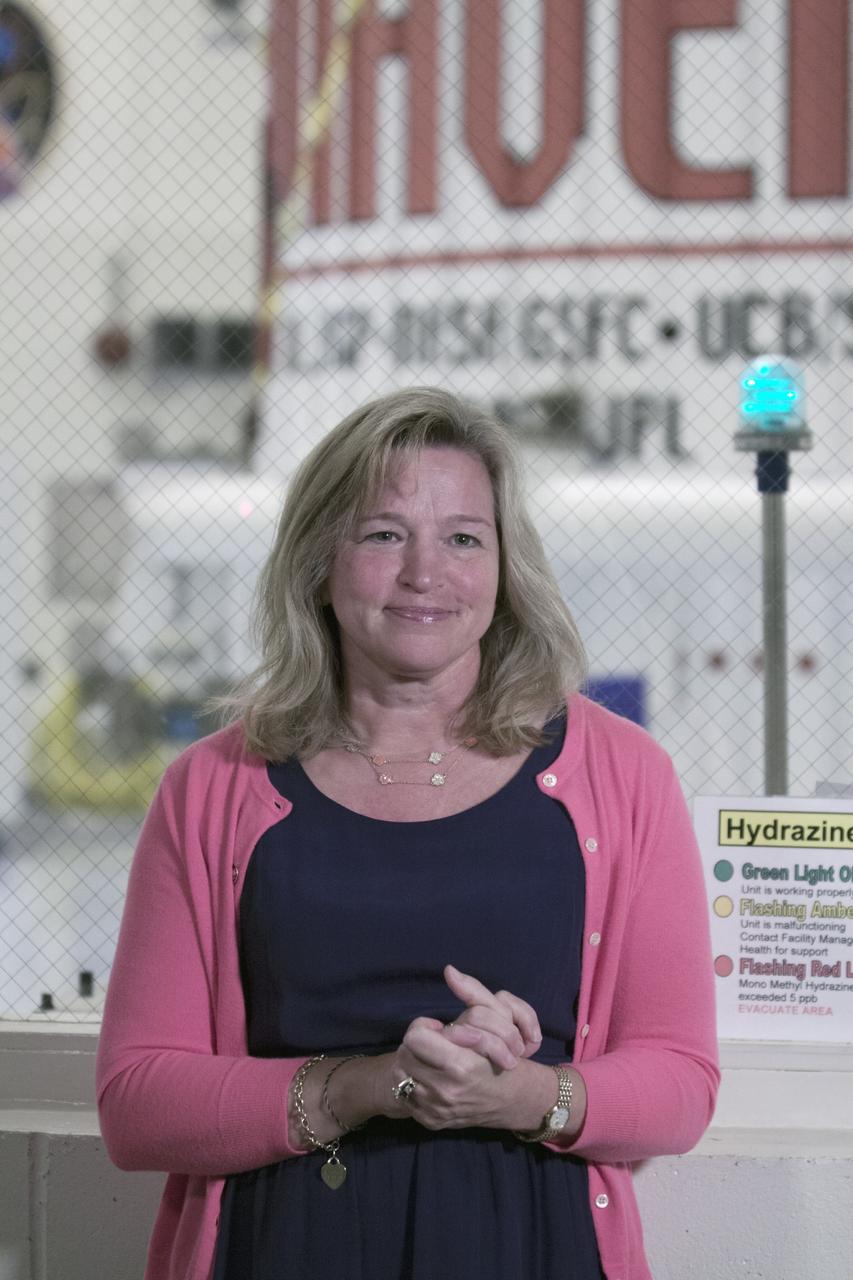 CAPE CANAVERAL, Fla. – Inside the Payload Hazardous Servicing Facility at NASA's Kennedy Space Center in Florida, Dr. Ellen Stofan, NASA's chief scientist, speaks to members of the news media. The Mars Atmosphere and Volatile Evolution, or MAVEN, spacecraft is in the background following encapsulation in its payload fairing.      MAVEN is being prepared for its scheduled launch on Nov 18, 2013 from Cape Canaveral Air Force Station, Fla. atop a United Launch Alliance Atlas V rocket. Positioned in an orbit above the Red Planet, MAVEN will study the upper atmosphere of Mars in unprecedented detail. For more information, visit: http://www.nasa.gov/mission_pages/maven/main/index.html Photo credit: NASA/Kim Shiflett