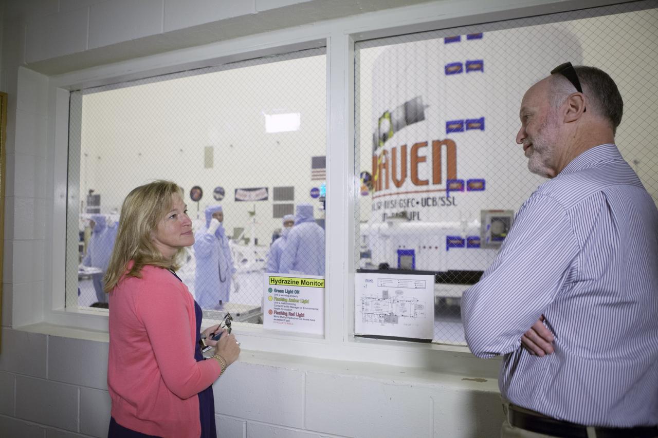 CAPE CANAVERAL, Fla. – Inside the Payload Hazardous Servicing Facility at NASA's Kennedy Space Center in Florida, Dr. Ellen Stofan, NASA's chief scientist, talks with Bruck Jakosky of the University of Colorado’s Laboratory for Atmospheric and Space Physics is the principal investigator for the Mars Atmosphere and Volatile Evolution, or MAVEN, mission. The MAVEN spacecraft can be seen through the window following encapsulation in its payload fairing.      MAVEN is being prepared for its scheduled launch on Nov 18, 2013 from Cape Canaveral Air Force Station, Fla. atop a United Launch Alliance Atlas V rocket. Positioned in an orbit above the Red Planet, MAVEN will study the upper atmosphere of Mars in unprecedented detail. For more information, visit: http://www.nasa.gov/mission_pages/maven/main/index.html Photo credit: NASA/Kim Shiflett