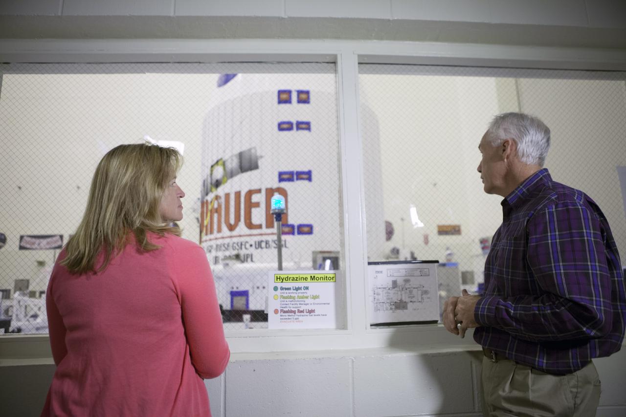 CAPE CANAVERAL, Fla. – Inside the Payload Hazardous Servicing Facility at NASA's Kennedy Space Center in Florida, Dr. Ellen Stofan, NASA's chief scientist, talks with Chuck Tatro of NASA's Launch Services Program. Tatro is mission manager for the Mars Atmosphere and Volatile Evolution, or MAVEN, mission. The MAVEN spacecraft can be seen through the window following encapsulation in its payload fairing.      MAVEN is being prepared for its scheduled launch on Nov 18, 2013 from Cape Canaveral Air Force Station, Fla. atop a United Launch Alliance Atlas V rocket. Positioned in an orbit above the Red Planet, MAVEN will study the upper atmosphere of Mars in unprecedented detail. For more information, visit: http://www.nasa.gov/mission_pages/maven/main/index.html Photo credit: NASA/Kim Shiflett