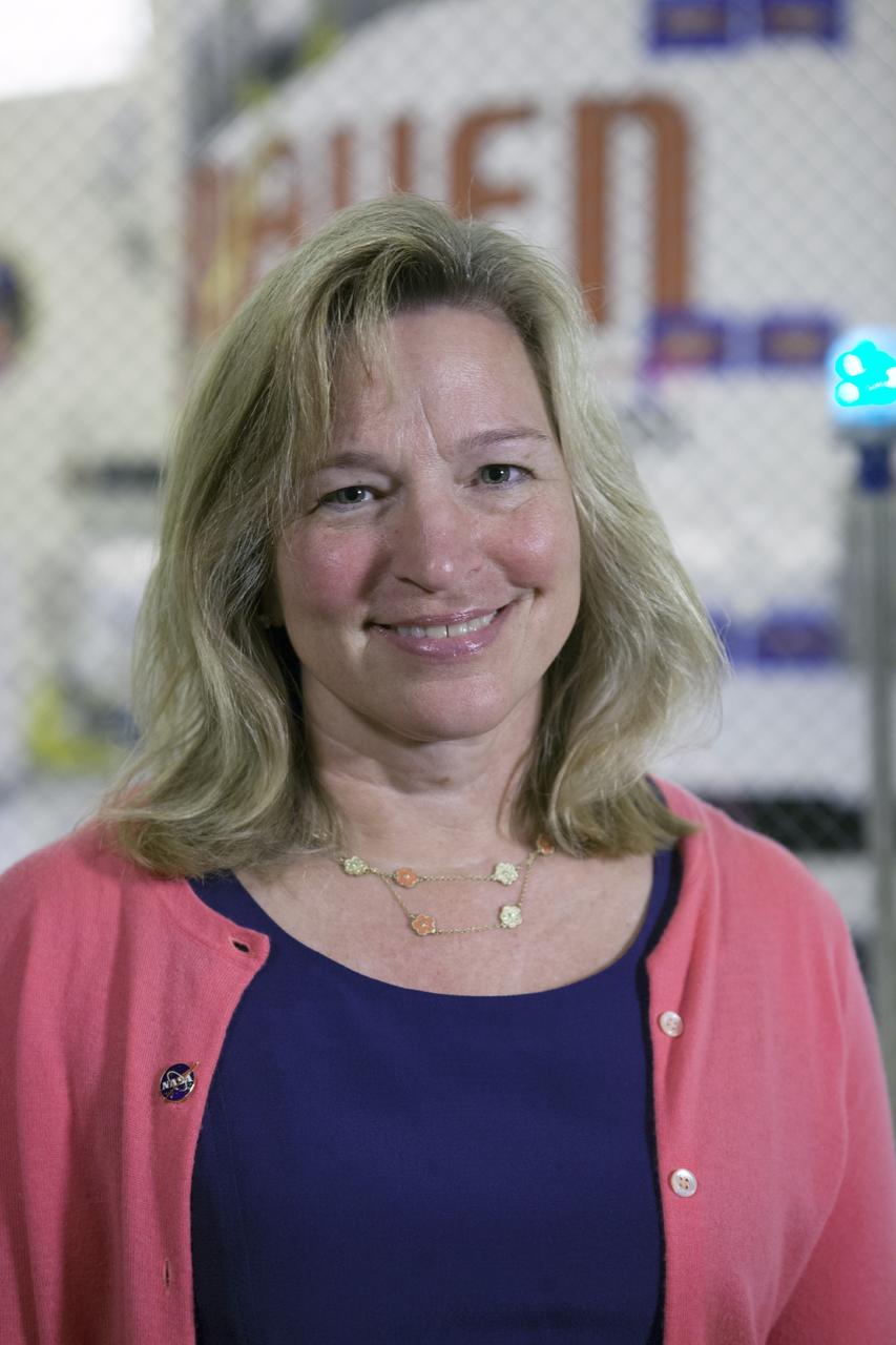 CAPE CANAVERAL, Fla. – Dr. Ellen Stofan, NASA's chief scientist. In the background inside the Payload Hazardous Servicing Facility at NASA's Kennedy Space Center in Florida is the Mars Atmosphere and Volatile Evolution, or MAVEN, spacecraft following encapsulation in its payload fairing.      MAVEN is being prepared for its scheduled launch on Nov 18, 2013 from Cape Canaveral Air Force Station, Fla. atop a United Launch Alliance Atlas V rocket. Positioned in an orbit above the Red Planet, MAVEN will study the upper atmosphere of Mars in unprecedented detail. For more information, visit: http://www.nasa.gov/mission_pages/maven/main/index.html Photo credit: NASA/Kim Shiflett
