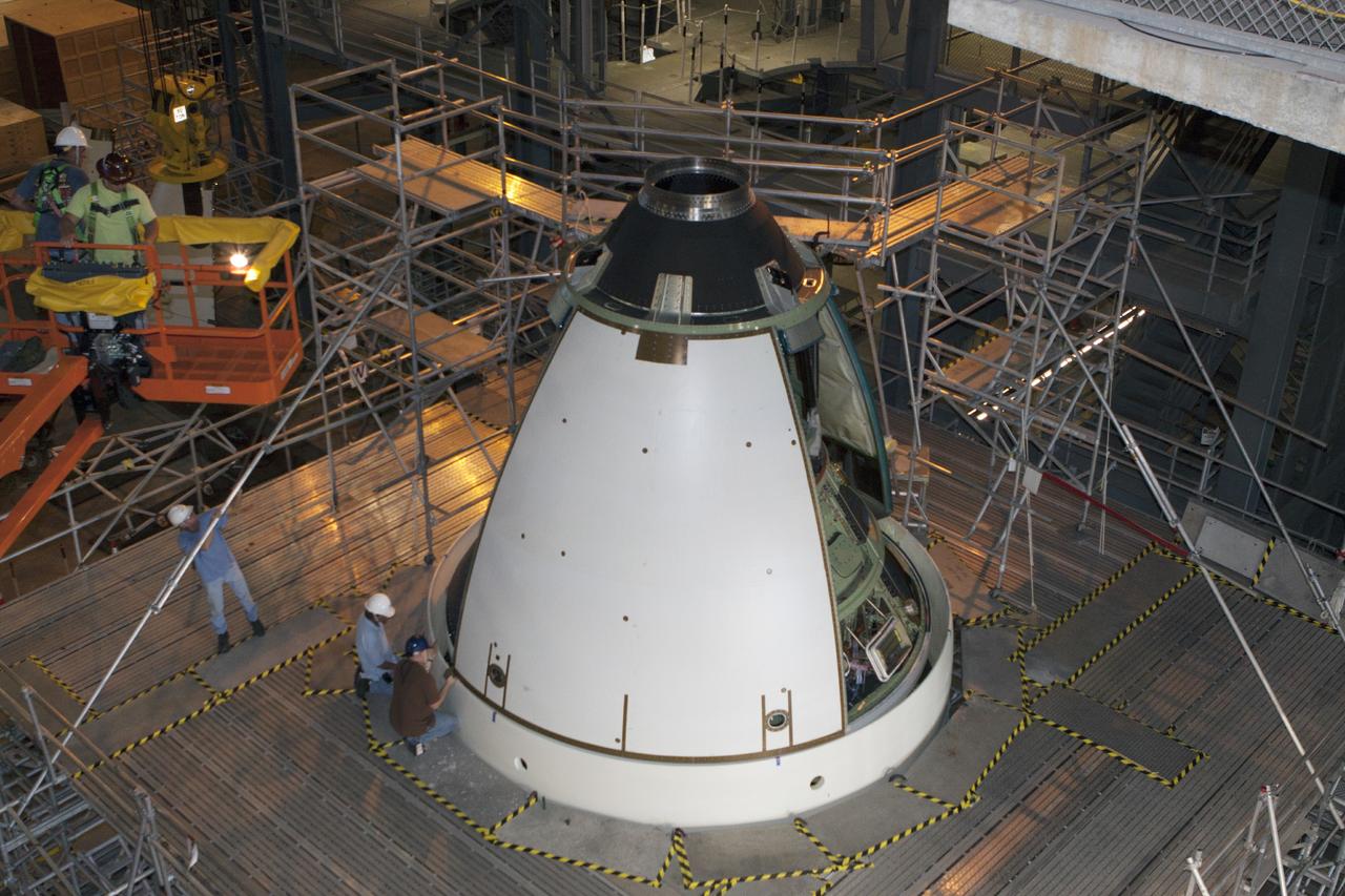 CAPE CANAVERAL, Fla. – At NASA’s Kennedy Space Center in Florida, technicians complete the installation of an ogive panel on the Orion ground test vehicle in Vehicle Assembly Building high bay 4. The ogive panels enclose the Orion spacecraft and attach to the Launch Abort System. The test vehicle is being used by the Ground Systems Development and Operations Program for path finding operations, including simulated manufacturing, assembly and stacking procedures. Orion is the exploration spacecraft designed to carry astronauts to destinations not yet explored by humans, including an asteroid and Mars. It will have emergency abort capability, sustain the crew during space travel and provide safe re-entry from deep space return velocities. The first unpiloted test flight of Orion is scheduled to launch in 2014 atop a Delta IV rocket and in 2017 on NASA’s Space Launch System rocket. For more information, visit www.nasa.gov/orion. Photo credit: Kim Shiflett