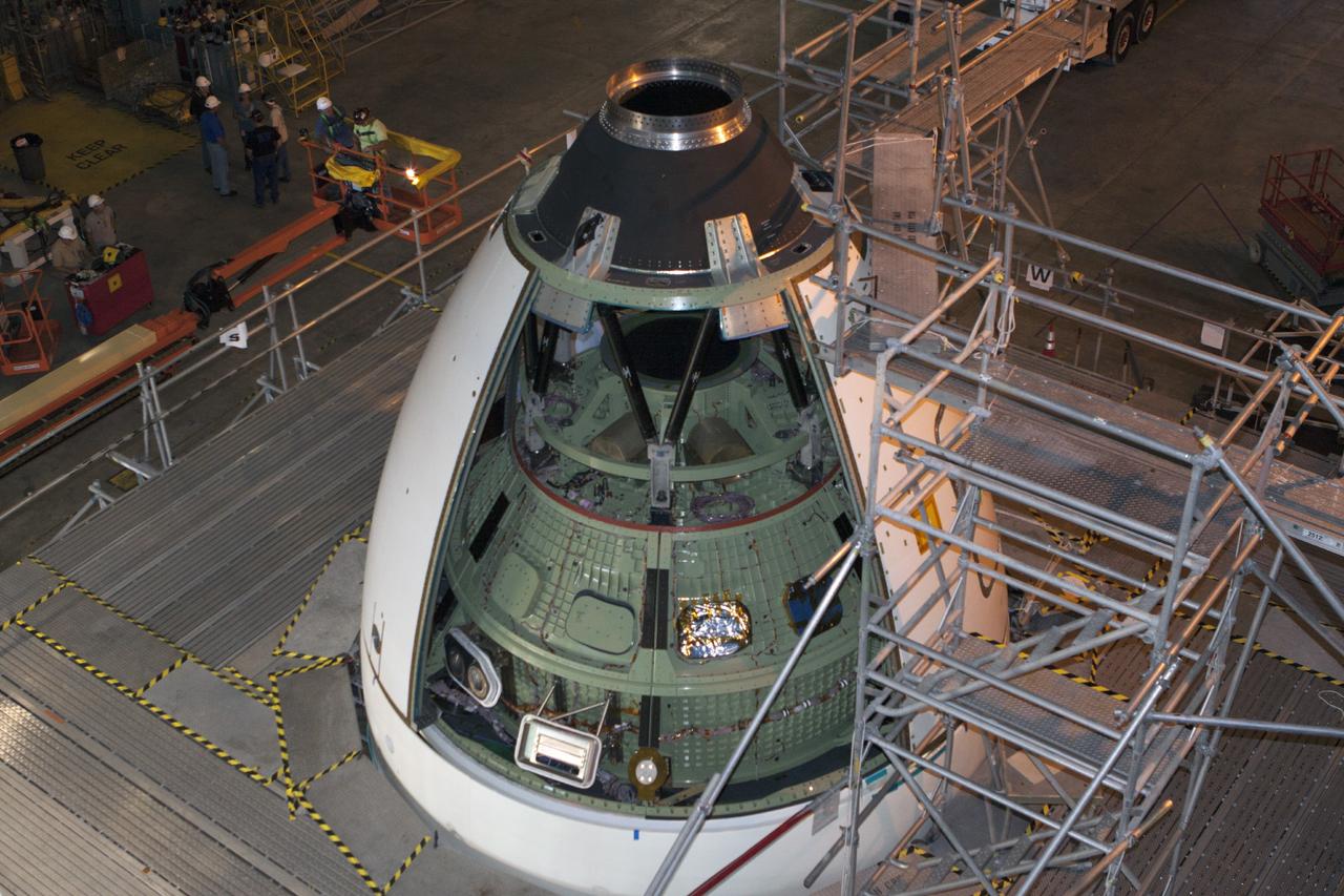 CAPE CANAVERAL, Fla. – At NASA’s Kennedy Space Center in Florida, several ogive panels have been installed on the Orion ground test vehicle in Vehicle Assembly Building high bay 4. The ogive panels enclose the Orion spacecraft and attach to the Launch Abort System. The test vehicle is being used by the Ground Systems Development and Operations Program for path finding operations, including simulated manufacturing, assembly and stacking procedures. Orion is the exploration spacecraft designed to carry astronauts to destinations not yet explored by humans, including an asteroid and Mars. It will have emergency abort capability, sustain the crew during space travel and provide safe re-entry from deep space return velocities. The first unpiloted test flight of Orion is scheduled to launch in 2014 atop a Delta IV rocket and in 2017 on NASA’s Space Launch System rocket. For more information, visit www.nasa.gov/orion. Photo credit: Kim Shiflett