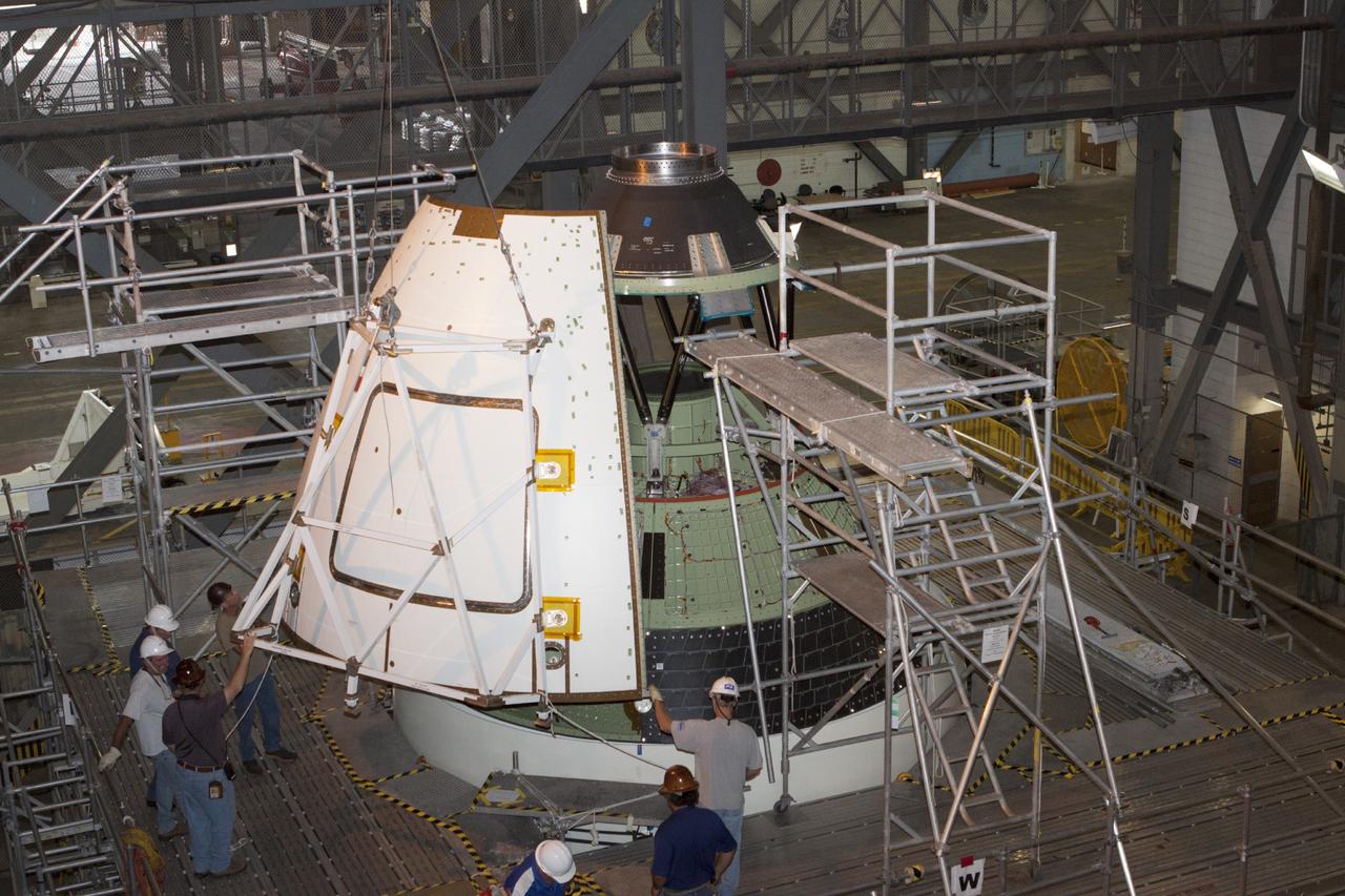 CAPE CANAVERAL, Fla. – At NASA’s Kennedy Space Center in Florida, technicians assist as a crane is used to move one of four ogive panels closer for installation on the Orion ground test vehicle in Vehicle Assembly Building high bay 4. The ogive panels enclose and protect the Orion spacecraft and attach to the Launch Abort System. The test vehicle is being used by the Ground Systems Development and Operations Program for path finding operations, including simulated manufacturing, assembly and stacking procedures. Orion is the exploration spacecraft designed to carry astronauts to destinations not yet explored by humans, including an asteroid and Mars. It will have emergency abort capability, sustain the crew during space travel and provide safe re-entry from deep space return velocities. The first unpiloted test flight of Orion is scheduled to launch in 2014 atop a Delta IV rocket and in 2017 on NASA’s Space Launch System rocket. For more information, visit www.nasa.gov/orion. Photo credit: Kim Shiflett