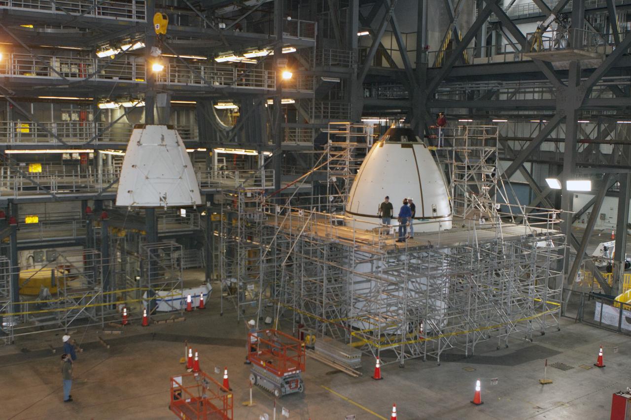 CAPE CANAVERAL, Fla. – At NASA’s Kennedy Space Center in Florida, technicians monitor the progress as the fourth ogive panel is lifted by crane so that they can be installed on the Orion ground test vehicle in Vehicle Assembly Building high bay 4. Three of the panels have already been installed on the test vehicle. The ogive panels enclose and protect the Orion spacecraft and attach to the Launch Abort System. The test vehicle is being used by the Ground Systems Development and Operations Program for path finding operations, including simulated manufacturing, assembly and stacking procedures. Orion is the exploration spacecraft designed to carry astronauts to destinations not yet explored by humans, including an asteroid and Mars. It will have emergency abort capability, sustain the crew during space travel and provide safe re-entry from deep space return velocities. The first unpiloted test flight of Orion is scheduled to launch in 2014 atop a Delta IV rocket and in 2017 on NASA’s Space Launch System rocket. For more information, visit www.nasa.gov/orion. Photo credit: Kim Shiflett