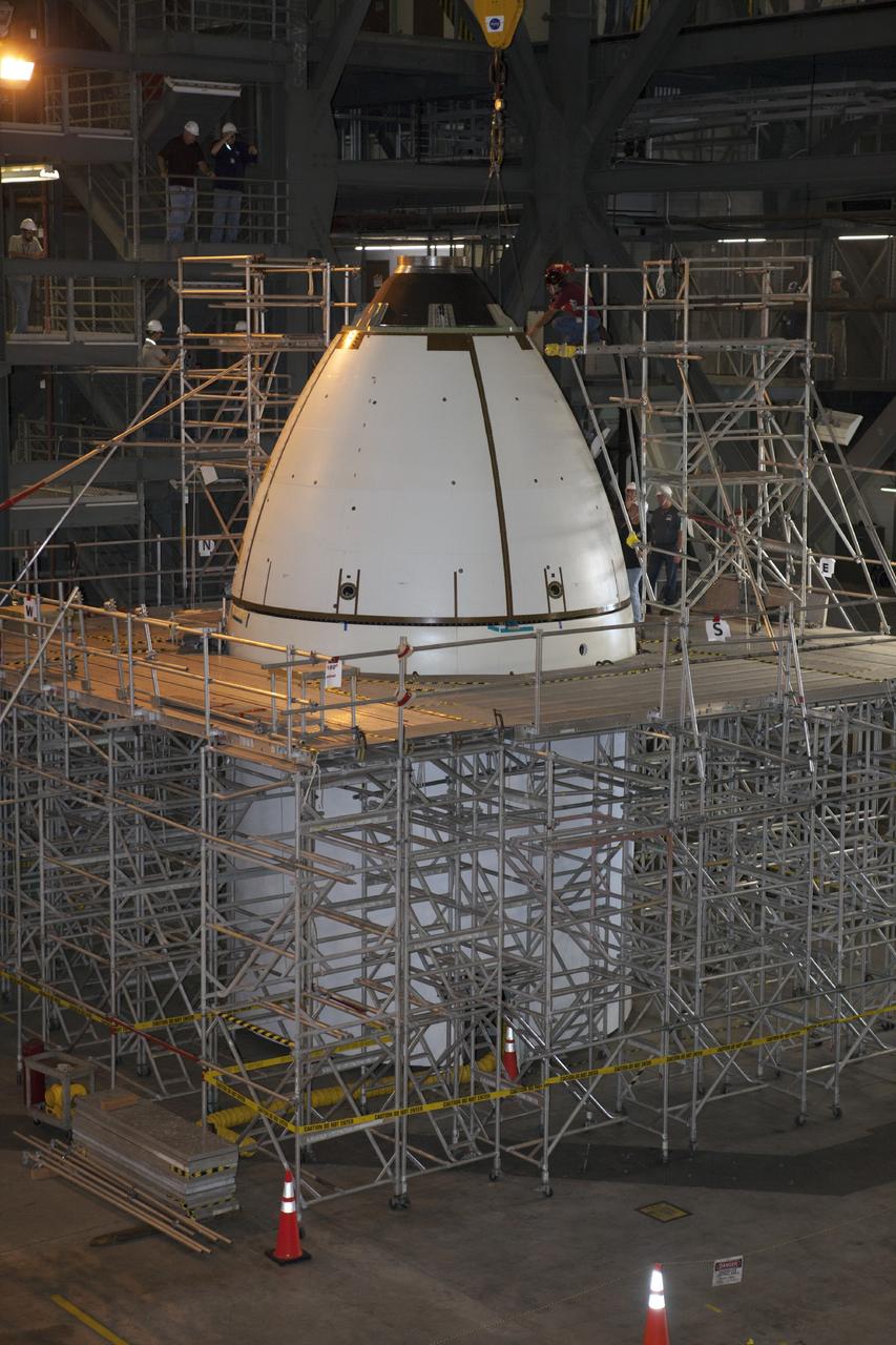 CAPE CANAVERAL, Fla. – At NASA’s Kennedy Space Center in Florida, all four ogive panels have been installed on the Orion ground test vehicle in Vehicle Assembly Building high bay 4. The ogive panels enclose and protect the Orion spacecraft and attach to the Launch Abort System. The test vehicle is being used by the Ground Systems Development and Operations Program for path finding operations, including simulated manufacturing, assembly and stacking procedures. Orion is the exploration spacecraft designed to carry astronauts to destinations not yet explored by humans, including an asteroid and Mars. It will have emergency abort capability, sustain the crew during space travel and provide safe re-entry from deep space return velocities. The first unpiloted test flight of Orion is scheduled to launch in 2014 atop a Delta IV rocket and in 2017 on NASA’s Space Launch System rocket. For more information, visit www.nasa.gov/orion. Photo credit: Kim Shiflett