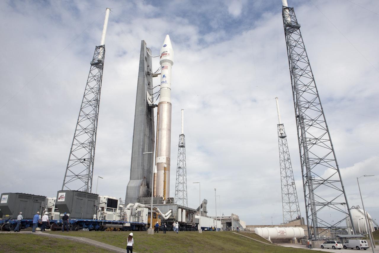 CAPE CANAVERAL, Fla. -- The United Launch Alliance Atlas V rocket carrying NASA’s Mars Atmosphere and Volatile EvolutioN, or MAVEN, spacecraft moves between the lightning masts at Space Launch Complex 41 on Cape Canaveral Air Force Station in Florida following a 20-minute journey from the Vertical Integration Facility. Rollout began on schedule with first motion at 9:57 a.m. EST. Launch is scheduled for Nov. 18 during a window that extends from 1:28 to 3:28 p.m. Once positioned in orbit above the Red Planet, MAVEN will study its upper atmosphere in unprecedented detail. For more information, visit: http://www.nasa.gov/mission_pages/maven/main/index.html. Photo credit: NASA/Kim Shiflett
