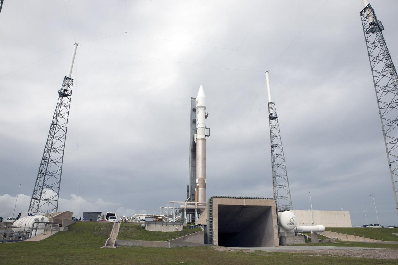 CAPE CANAVERAL, Fla. -- The United Launch Alliance Atlas V rocket carrying NASA’s Mars Atmosphere and Volatile EvolutioN, or MAVEN, spacecraft moves into position behind the flame exhaust duct at Space Launch Complex 41 on Cape Canaveral Air Force Station in Florida following a 20-minute journey from the Vertical Integration Facility. Rollout began on schedule with first motion at 9:57 a.m. EST. Launch is scheduled for Nov. 18 during a window that extends from 1:28 to 3:28 p.m. Once positioned in orbit above the Red Planet, MAVEN will study its upper atmosphere in unprecedented detail. For more information, visit: http://www.nasa.gov/mission_pages/maven/main/index.html. Photo credit: NASA/Kim Shiflett