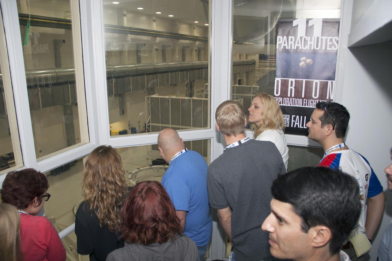 CAPE CANAVERAL, Fla. -- Social media participants are given an opportunity to look into the high bay of the Operations and Checkout Building at NASA's Kennedy Space Center in Florida where the Orion spacecraft is being prepared for its first unpiloted flight during 2014. The participants were on hand for the upcoming launch of the Mars Atmosphere and Volatile Evolution, or MAVEN, mission.      Their visit included tours of key facilities at the Florida Spaceport and participating in presentations by key NASA leaders who updated the space agency's current efforts. Photo credit: NASA/Jim Grossman
