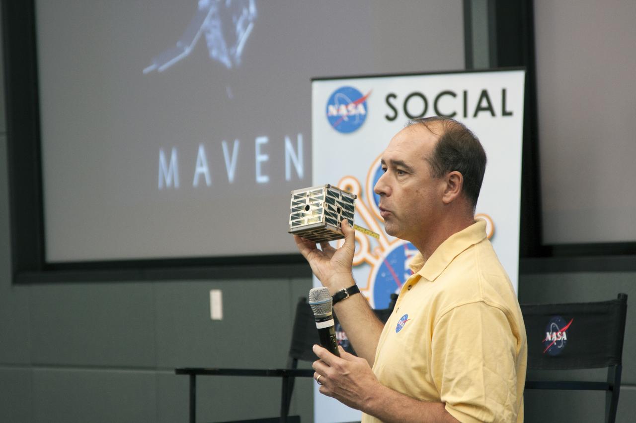 CAPE CANAVERAL, Fla. -- In the conference room of Operations Support Building II at NASA's Kennedy Space Center in Florida, social media participants listen to a briefing on the agency's CubeSat Program by Andrew Petro, small satellites program manager.      The social media participants gathered at the Florida spaceport for the launch of the Mars Atmosphere and Volatile Evolution, or MAVEN, spacecraft. Their visit included tours of key facilities and participating in presentations by key NASA leaders who updated the space agency's current efforts. Photo credit: NASA/Jim Grossman