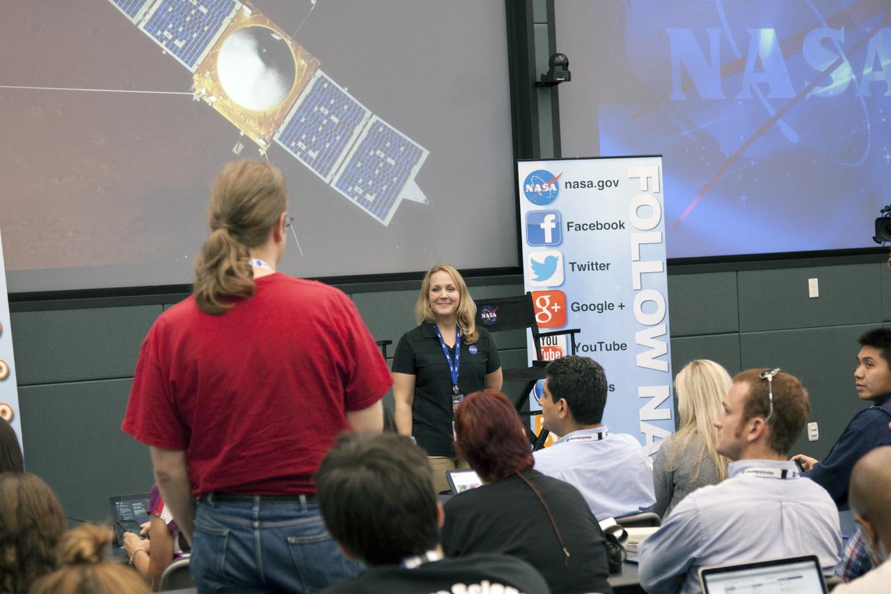 CAPE CANAVERAL, Fla. -- In the conference room of Operations Support Building II at NASA's Kennedy Space Center in Florida, social media participants listen to a briefing on agency programs by Lindsay Hays, an astrobiologist at NASA Headquarters.      The social media participants gathered at the Florida spaceport for the launch of the Mars Atmosphere and Volatile Evolution, or MAVEN, spacecraft. Their visit included tours of key facilities and participating in presentations by key NASA leaders who updated the space agency's current efforts. Photo credit: NASA/Jim Grossman