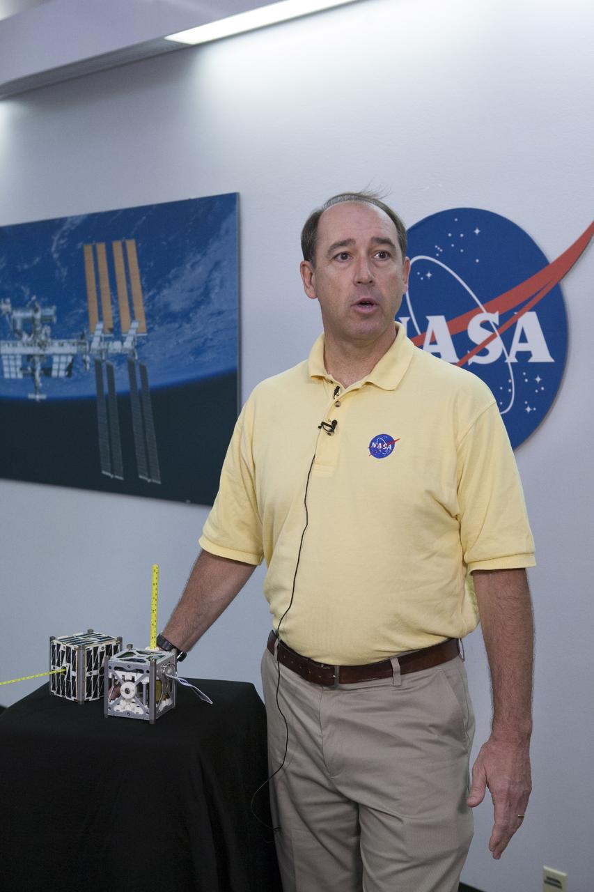 CAPE CANAVERAL, Fla. -- At the News Center at NASA's Kennedy Space Center in Florida, Andrew Petro, the agency's acting director of the Early Stage Innovation Division of the Office of the Chief Technologist, discusses the agency’s CubeSat Launch initiative. CubeSats provide opportunities for small satellite payloads to fly on rockets planned for upcoming launches.      CubeSats, a class of research spacecraft called nanosatellites, are flown as auxiliary payloads on previously planned missions. The cube-shaped satellites are approximately four inches long, have a volume of about one quart and weigh about three pounds. For more information, visit: http://www.nasa.gov/directorates/heo/home/CubeSats_initiative.html Photo credit: NASA/Kim Shiflett