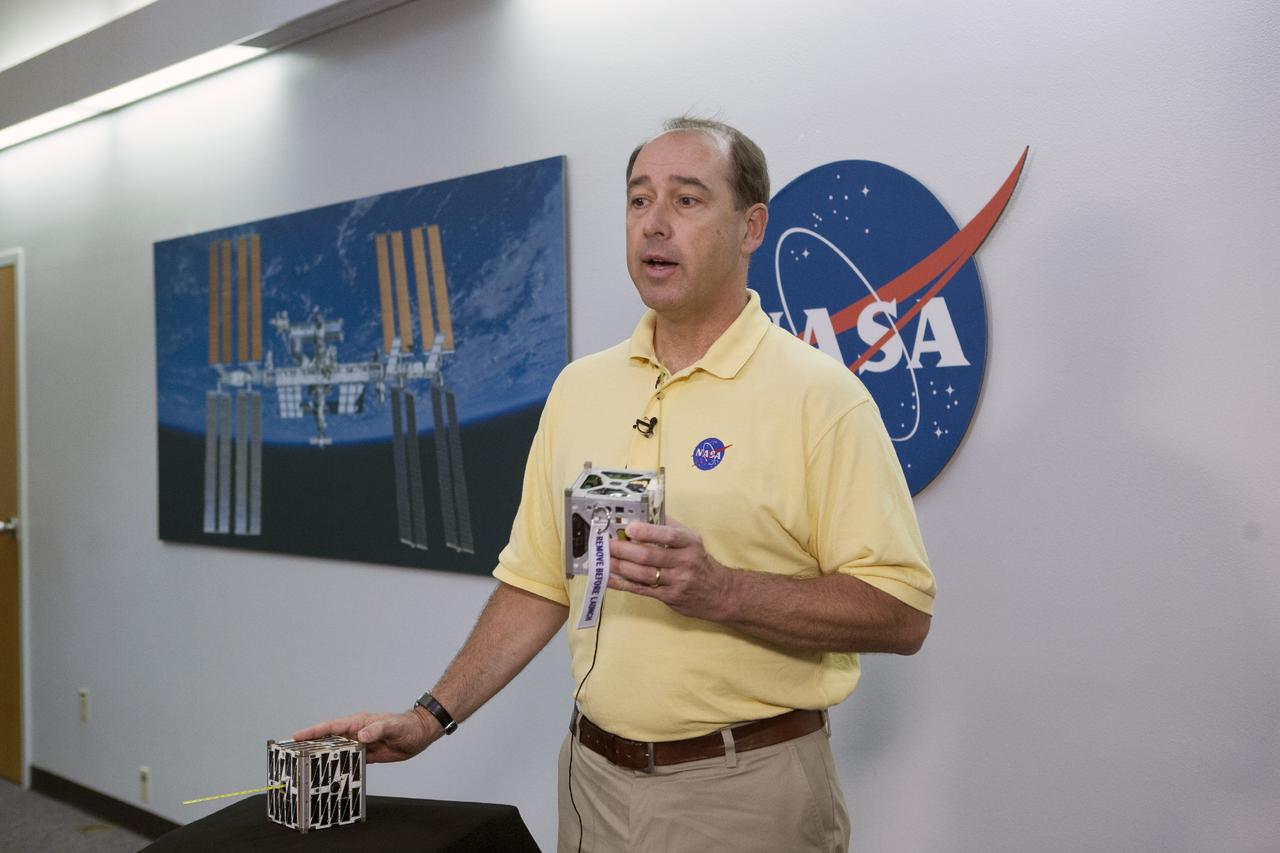 CAPE CANAVERAL, Fla. -- At the News Center at NASA's Kennedy Space Center in Florida, Andrew Petro, the agency's acting director of the Early Stage Innovation Division of the Office of the Chief Technologist, discusses the agency’s CubeSat Launch initiative. CubeSats provide opportunities for small satellite payloads to fly on rockets planned for upcoming launches.      CubeSats, a class of research spacecraft called nanosatellites, are flown as auxiliary payloads on previously planned missions. The cube-shaped satellites are approximately four inches long, have a volume of about one quart and weigh about three pounds. For more information, visit: http://www.nasa.gov/directorates/heo/home/CubeSats_initiative.html Photo credit: NASA/Kim Shiflett