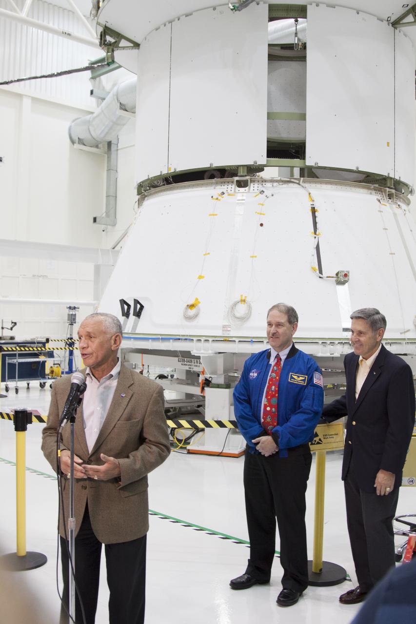 CAPE CANAVERAL, Fla. – Inside the Operations and Checkout Building high bay at NASA’s Kennedy Space Center in Florida, agency Administrator Charles Bolden speaks to members of the news media about ongoing preparations of the Orion spacecraft for its first unpiloted launch, Exploration Test Flight 1. Standing behind Bolden are John Grunsfeld, NASA associate administrator for the Science Mission Directorate, left and center Director Bob Cabana.      Orion is the exploration spacecraft designed to carry crews to space beyond low Earth orbit. It will provide emergency abort capability, sustain the crew during the space travel and provide safe re-entry from deep space return velocities. Orion’s first unpiloted test launch is scheduled for liftoff during 2014 atop a Delta IV rocket. A second unpiloted flight test is scheduled for 2017 on NASA’s Space Launch System rocket. For more information, visit http://www.nasa.gov/orion Photo credit: NASA/Jim Grossman