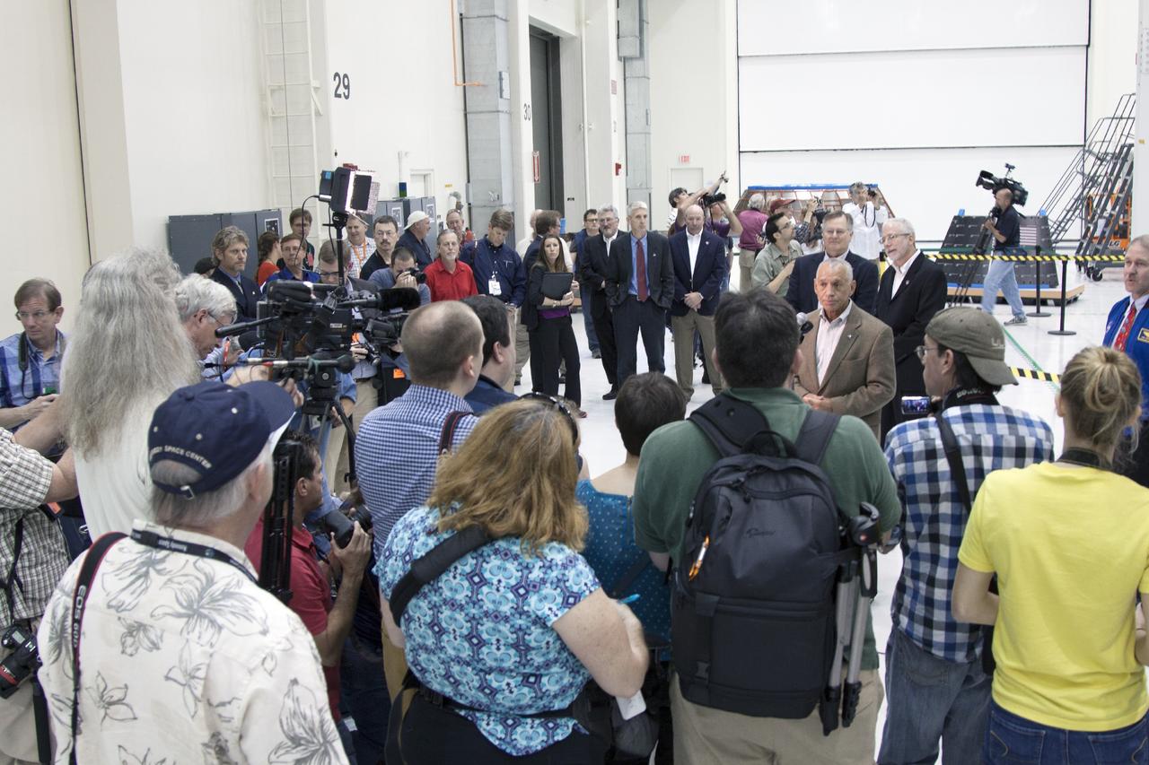 CAPE CANAVERAL, Fla. – Inside the Operations and Checkout Building high bay at NASA’s Kennedy Space Center in Florida, agency Administrator Charles Bolden answers questions from members of the news media about ongoing preparations of the Orion spacecraft for its first unpiloted launch, Exploration Test Flight 1.      Orion is the exploration spacecraft designed to carry crews to space beyond low Earth orbit. It will provide emergency abort capability, sustain the crew during the space travel and provide safe re-entry from deep space return velocities. Orion’s first unpiloted test launch is scheduled for liftoff during 2014 atop a Delta IV rocket. A second unpiloted flight test is scheduled for 2017 on NASA’s Space Launch System rocket. For more information, visit http://www.nasa.gov/orion Photo credit: NASA/Jim Grossman