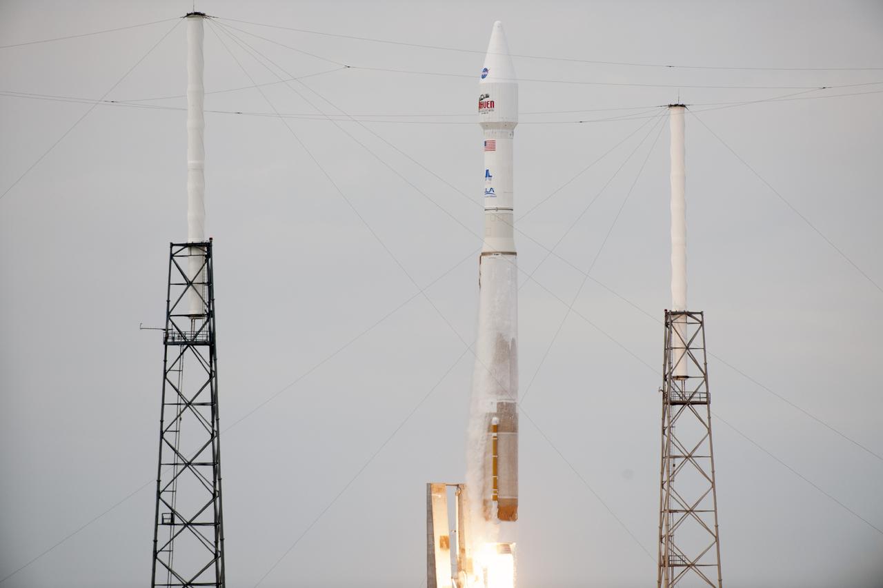 CAPE CANAVERAL, Fla. -- A United Launch Alliance Atlas V rocket lifts off past the lightning masts on Space Launch Complex 41 at Cape Canaveral Air Force Station in Florida, carrying NASA's Mars Atmosphere and Volatile EvolutioN, or MAVEN, spacecraft.    Launch was on schedule at 1:28 p.m. EST Nov. 18 at the opening of a two-hour launch window. After a 10-month journey to the Red Planet, MAVEN will study its upper atmosphere in unprecedented detail from orbit above the planet. Built by Lockheed Martin in Littleton, Colo., MAVEN will arrive at Mars in September 2014 and will be inserted into an elliptical orbit with a high point of 3,900 miles, swooping down to as close as 93 miles above the planet's surface. For more information, visit: http://www.nasa.gov/mission_pages/maven/main/index.html. Photo credit: NASA/Rusty Backer