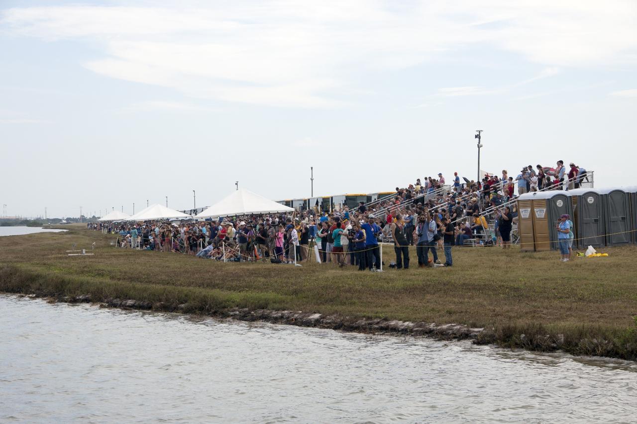 CAPE CANAVERAL, Fla. -- Invited guests watch the launch of NASA’s Mars Atmosphere and Volatile EvolutioN, or MAVEN, spacecraft from the NASA Causeway between NASA's Kennedy Space Center and Cape Canaveral Air Force Station in Florida.      Launch was on schedule at 1:28 p.m. EST Nov. 18 at the opening of a two-hour launch window. After a 10-month journey to the Red Planet, MAVEN will study its upper atmosphere in unprecedented detail from orbit above the planet. Built by Lockheed Martin in Littleton, Colo., MAVEN will arrive at Mars in September 2014 and will be inserted into an elliptical orbit with a high point of 3,900 miles, swooping down to as close as 93 miles above the planet's surface. For more information, visit: http://www.nasa.gov/mission_pages/maven/main/index.html. Photo credit: NASA/Jim Grossmann