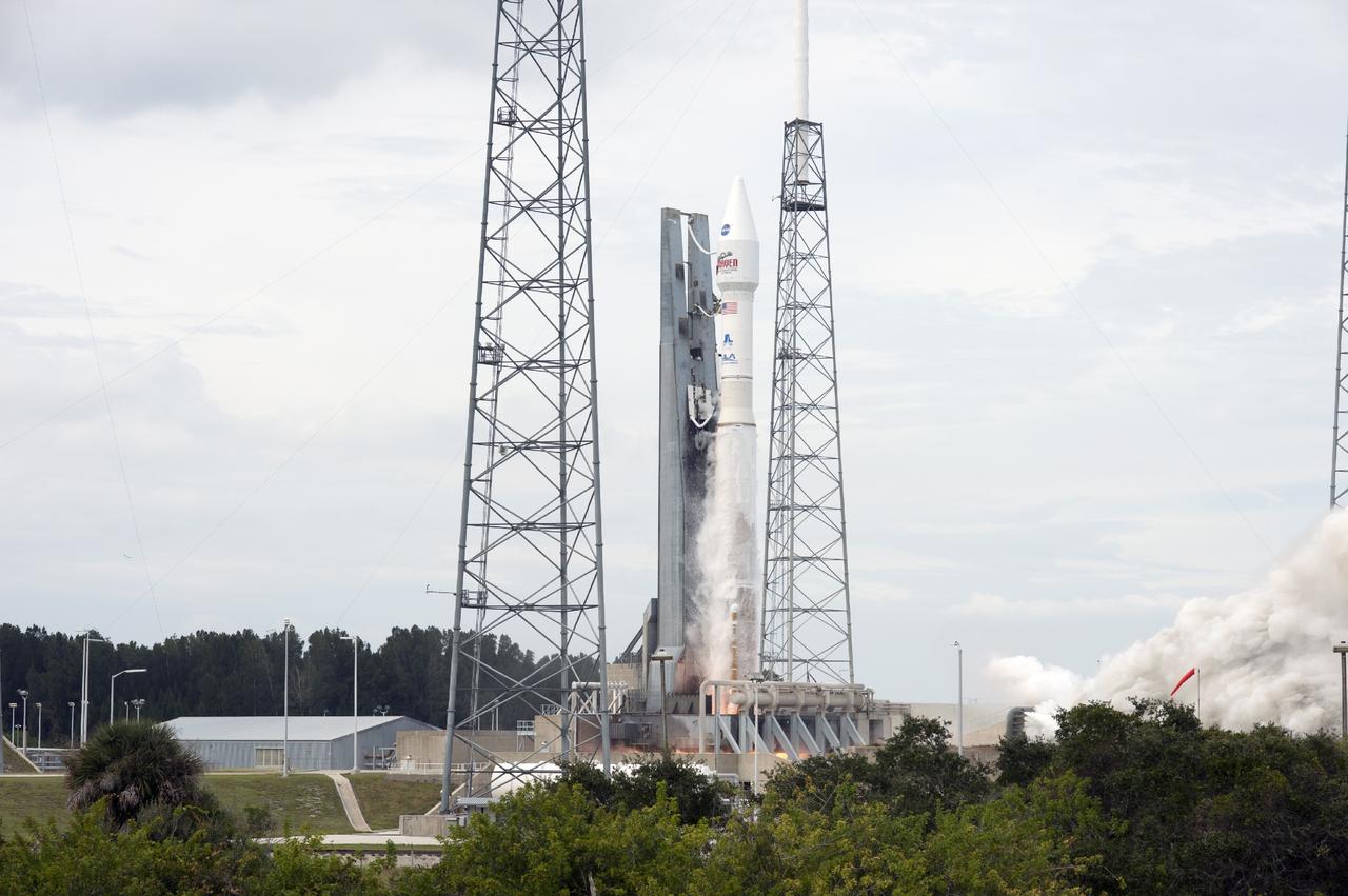 CAPE CANAVERAL, Fla. -- An exhaust plume forms at Space Launch Complex 41 on Cape Canaveral Air Force Station in Florida as the engine ignites under the United Launch Alliance Atlas V rocket carrying NASA's Mars Atmosphere and Volatile EvolutioN, or MAVEN, spacecraft into orbit. Launch was on schedule at 1:28 p.m. EST Nov. 18 at the opening of a two-hour launch window. After a 10-month journey to the Red Planet, MAVEN will study its upper atmosphere in unprecedented detail from orbit above the planet. Built by Lockheed Martin in Littleton, Colo., MAVEN will arrive at Mars in September 2014 and will be inserted into an elliptical orbit with a high point of 3,900 miles, swooping down to as close as 93 miles above the planet's surface. For more information, visit: http://www.nasa.gov/mission_pages/maven/main/index.html. Photo credit: NASA/Tony Gray and Rick Wetherington
