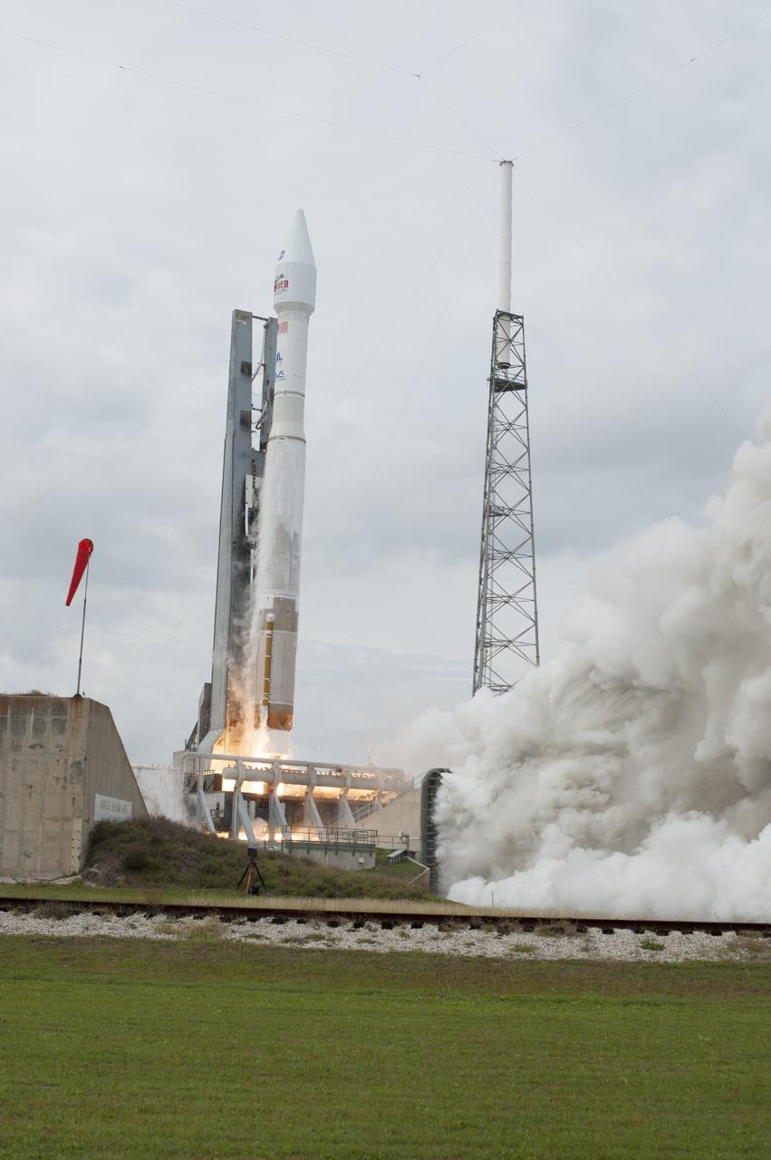 CAPE CANAVERAL, Fla. -- The exhaust plume builds at Space Launch Complex 41 on Cape Canaveral Air Force Station in Florida as the engine ignites under the United Launch Alliance Atlas V rocket carrying NASA's Mars Atmosphere and Volatile EvolutioN, or MAVEN, spacecraft to orbit. Launch was on schedule at 1:28 p.m. EST Nov. 18 at the opening of a two-hour launch window. After a 10-month journey to the Red Planet, MAVEN will study its upper atmosphere in unprecedented detail from orbit above the planet. Built by Lockheed Martin in Littleton, Colo., MAVEN will arrive at Mars in September 2014 and will be inserted into an elliptical orbit with a high point of 3,900 miles, swooping down to as close as 93 miles above the planet's surface. For more information, visit: http://www.nasa.gov/mission_pages/maven/main/index.html. Photo credit: NASA/Tony Gray and Rick Wetherington
