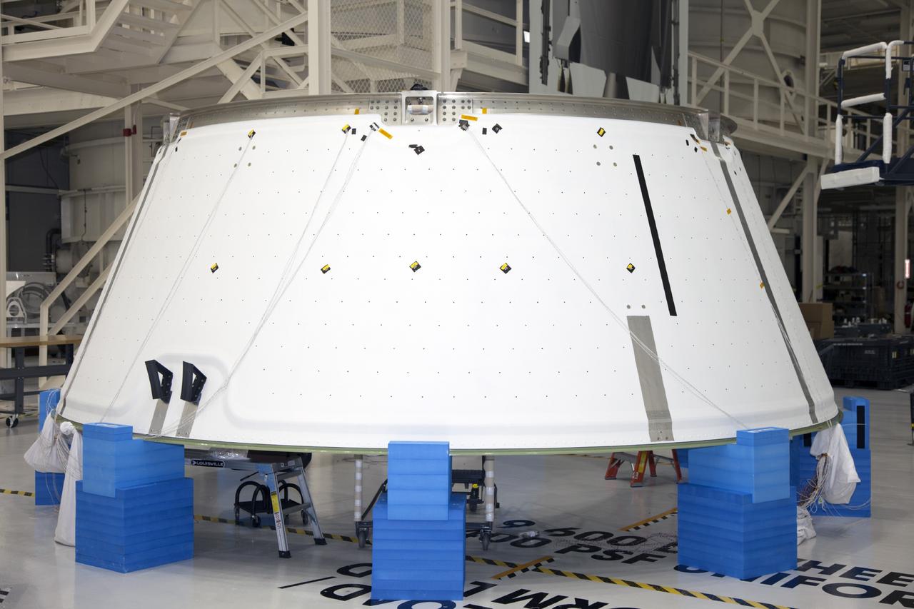 CAPE CANAVERAL, Fla. -- Inside the Operations and Checkout Building high bay at NASA’s Kennedy Space Center in Florida, the spacecraft adapter cone for the Orion spacecraft is positioned on special protective blocks for processing work. It will be mated to the service module for testing. Orion is the exploration spacecraft designed to carry astronauts to destinations not yet explored by humans, including an asteroid and Mars. It will have emergency abort capability, sustain the crew during space travel and provide safe re-entry from deep space return velocities. The first unpiloted test flight of the Orion is scheduled to launch in 2014 atop a Delta IV rocket and in 2017 on NASA’s Space Launch System rocket. For more information, visit http://www.nasa.gov/orion. Photo credit: NASA/Daniel Casper