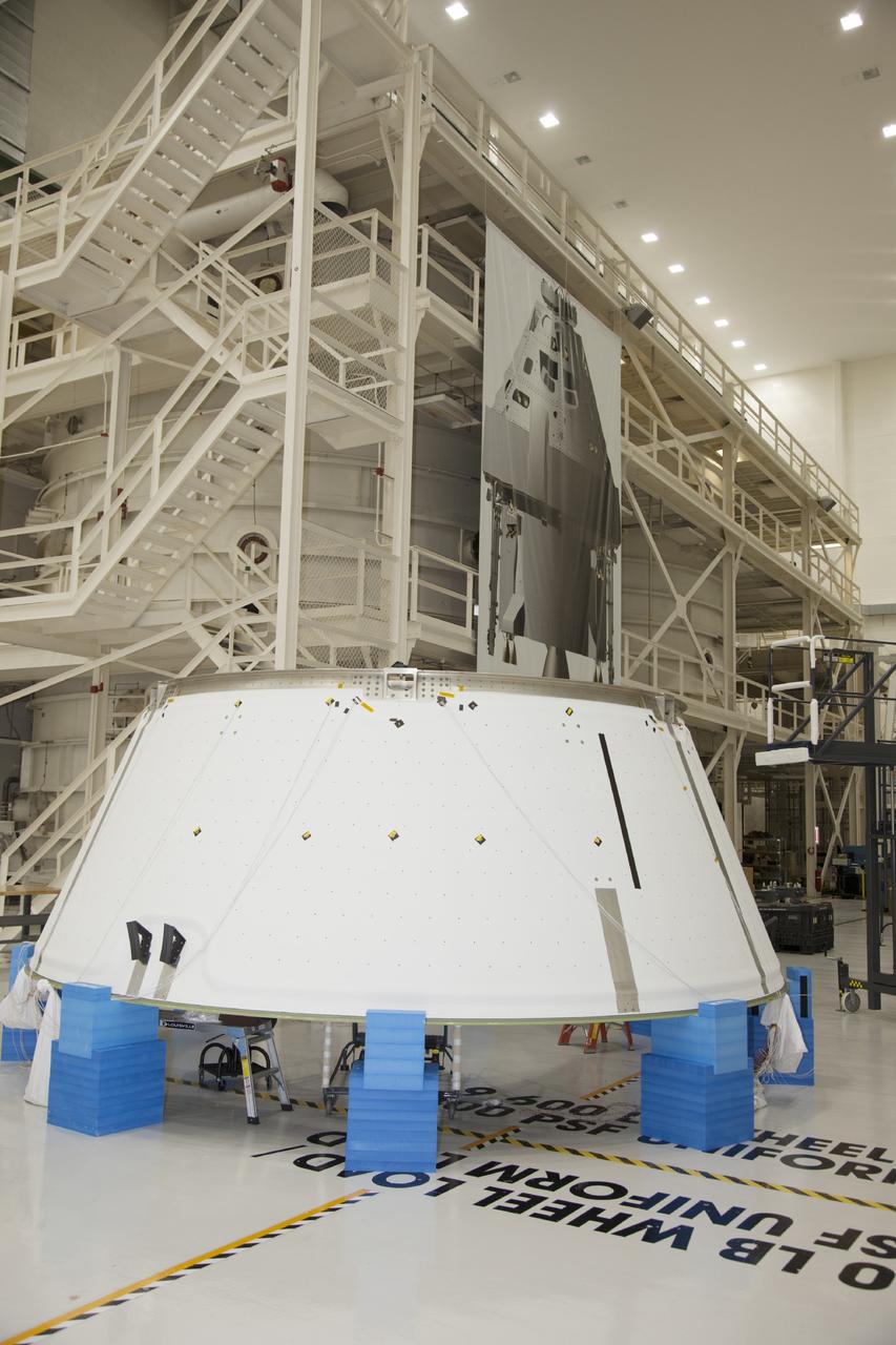 CAPE CANAVERAL, Fla. -- Inside the Operations and Checkout Building high bay at NASA’s Kennedy Space Center in Florida, the spacecraft adapter cone for the Orion spacecraft is positioned on special protective blocks for processing work. It will be mated to the service module for testing. Orion is the exploration spacecraft designed to carry astronauts to destinations not yet explored by humans, including an asteroid and Mars. It will have emergency abort capability, sustain the crew during space travel and provide safe re-entry from deep space return velocities. The first unpiloted test flight of the Orion is scheduled to launch in 2014 atop a Delta IV rocket and in 2017 on NASA’s Space Launch System rocket. For more information, visit http://www.nasa.gov/orion. Photo credit: NASA/Daniel Casper