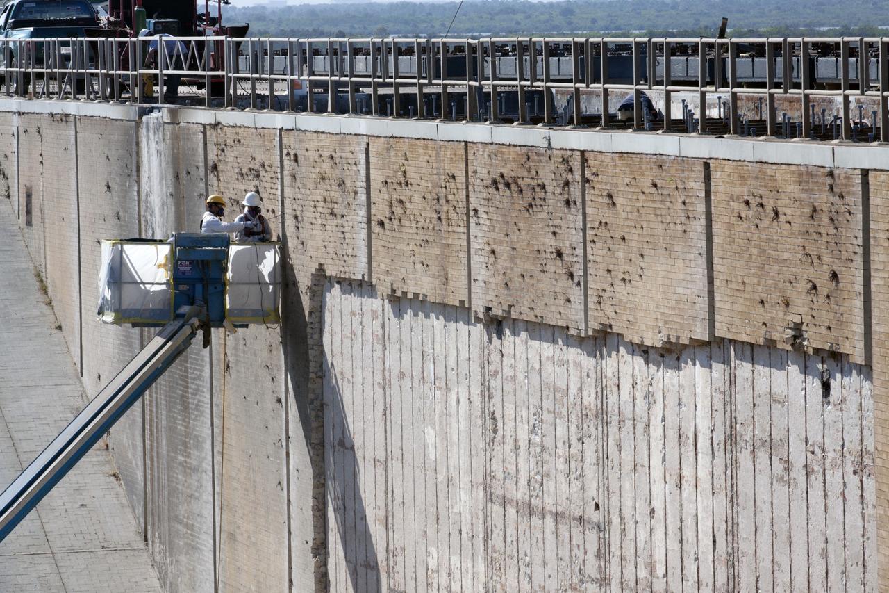 CAPE CANAVERAL, Fla. -- At Launch Pad 39B at NASA’s Kennedy Space Center in Florida, construction workers continue to remove the bricks from the flame trench walls that are below and between the left and right crawlerway tracks. The space shuttle-era flame trench deflector has been completely removed.      Launch Pad 39B is being refurbished to support NASA’s Space Launch System and other launch vehicles. The Ground Systems Development and Operations, or GSDO, Program office at Kennedy is leading the center’s transformation to safely handle a variety of rockets and spacecraft. For more information about GSDO, visit: http://go.nasa.gov/groundsystems.  Photo credit: NASA/Kim Shiflett
