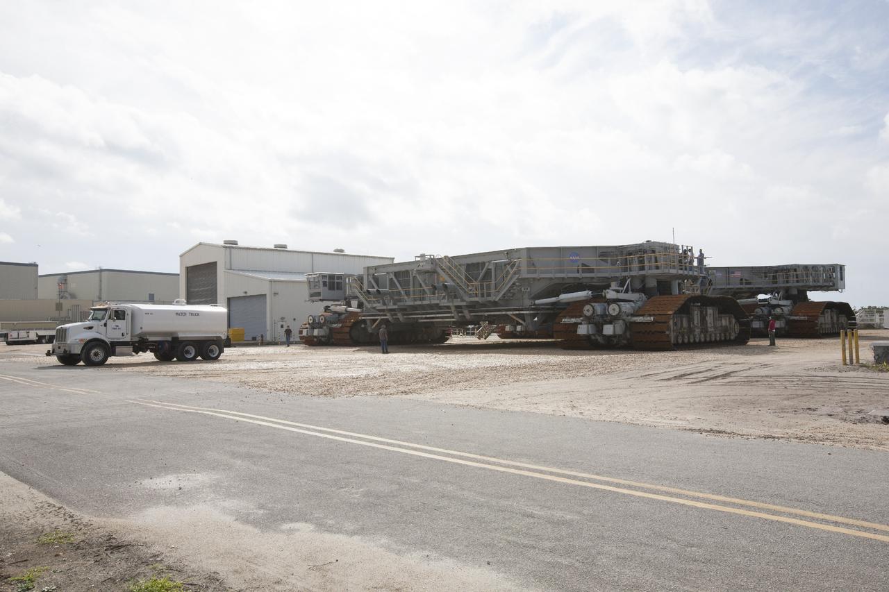 CAPE CANAVERAL, Fla. -- Crawler-transporter 1 begins its trek from the crawler transporter maintenance facility to Launch Pad 39A at NASA’s Kennedy Space Center in Florida. New jacking, equalizing and leveling, or JEL, hydraulic cylinders were installed on CT-1 and are being tested for increased load carrying capacity and reliability. The Ground Systems Development and Operations Program at Kennedy continues to upgrade the crawler-transporter as part of its general maintenance. CT-1 could be available to carry a variety of launch vehicles to the launch pad. Two crawler-transporters were used to carry the mobile launcher platform and space shuttle to Launch Complex 39 for space shuttle launches for 30 years. Photo credit: NASA/Daniel Casper
