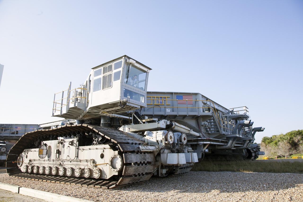 CAPE CANAVERAL, Fla. -- Crawler-transporter 1 continues its trek from the crawler transporter maintenance facility to Launch Pad 39A at NASA’s Kennedy Space Center in Florida. New jacking, equalizing and leveling, or JEL, hydraulic cylinders were installed on CT-1 and are being tested for increased load carrying capacity and reliability. The Ground Systems Development and Operations Program at Kennedy continues to upgrade the crawler-transporter as part of its general maintenance. CT-1 could be available to carry a variety of launch vehicles to the launch pad. Two crawler-transporters were used to carry the mobile launcher platform and space shuttle to Launch Complex 39 for space shuttle launches for 30 years. Photo credit: NASA/Daniel Casper
