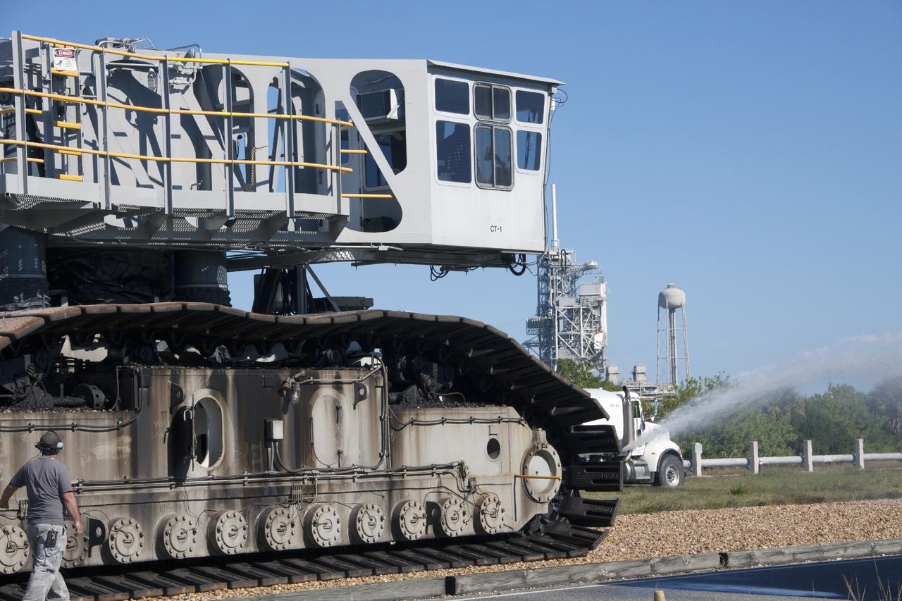CAPE CANAVERAL, Fla. -- A driver works the controls inside the cab on crawler-transporter 1 as it makes the trek on the crawlerway to Launch Pad 39A at NASA’s Kennedy Space Center in Florida. New jacking, equalizing and leveling, or JEL, hydraulic cylinders were installed on CT-1. They will be tested for increased load carrying capacity and reliability. The Ground Systems Development and Operations Program at Kennedy continues to upgrade the crawler-transporter as part of its general maintenance. CT-1 could be available to carry a variety of launch vehicles to the launch pad. Two crawler-transporters were used to carry the mobile launcher platform and space shuttle to Launch Complex 39 for space shuttle launches for 30 years. Photo credit: NASA/Jim Grossmann